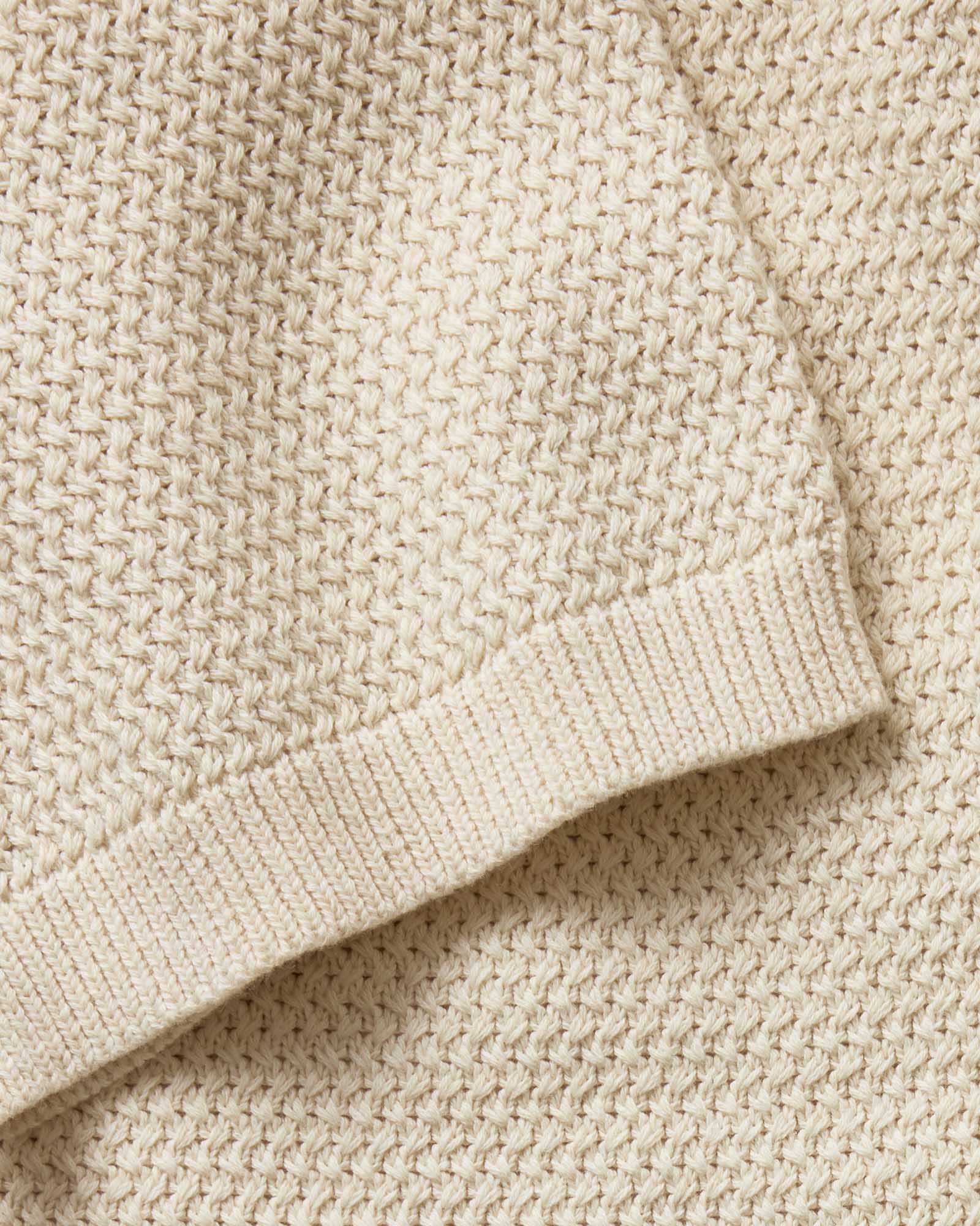 material shot of the sleeve on The Button Down Polo in Heather Oat Crochet, Knits by Taylor Stitch