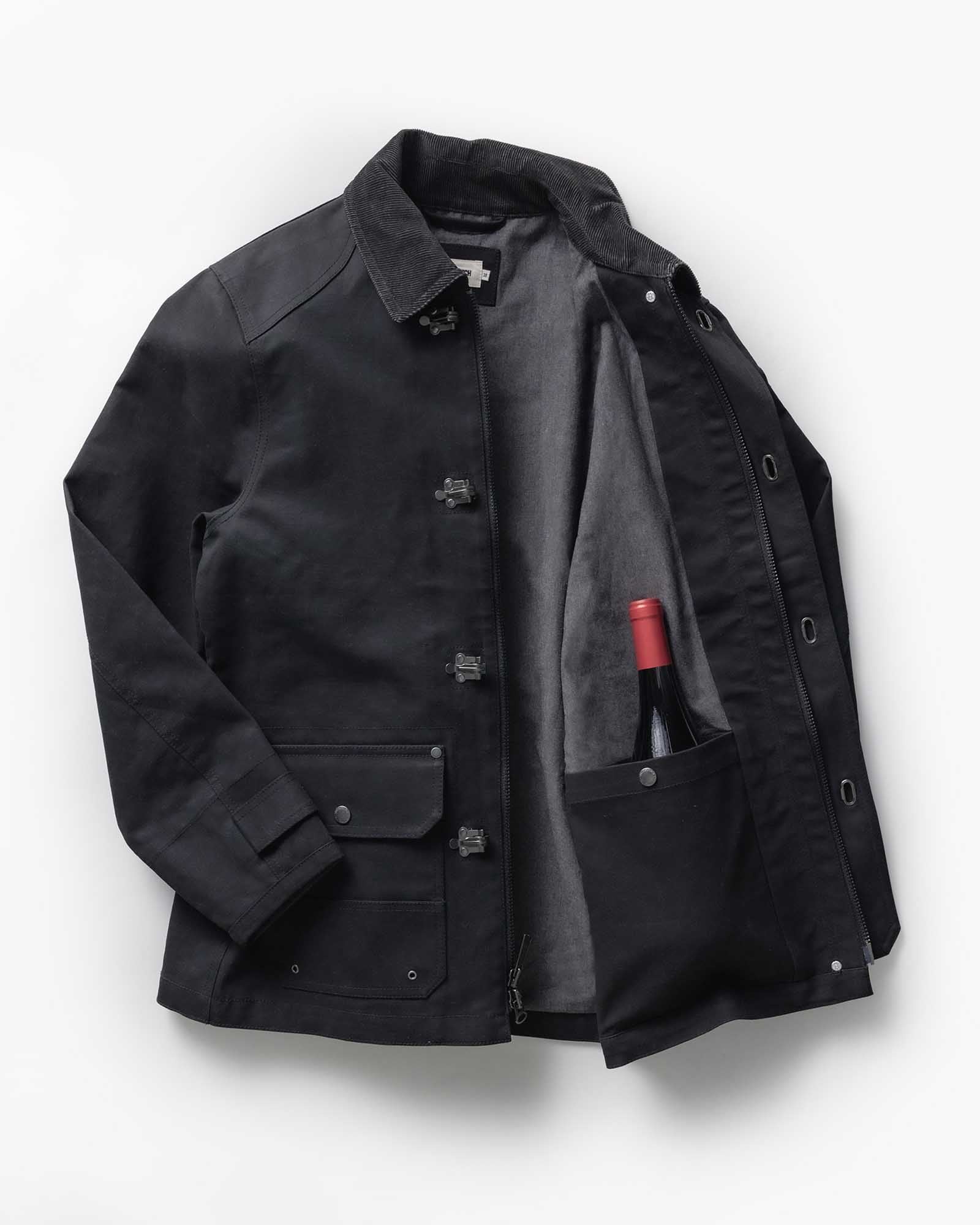 editorial flatlay of The Cinder Jacket in Coal Dry Wax, Outerwear by Taylor Stitch