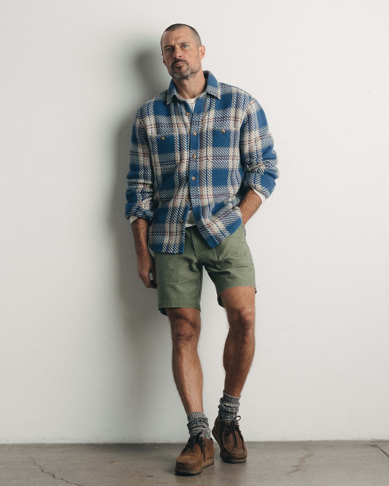 fit model posing in The Cutter Overshirt in Ocean Plaid, Wovens by Taylor Stitch