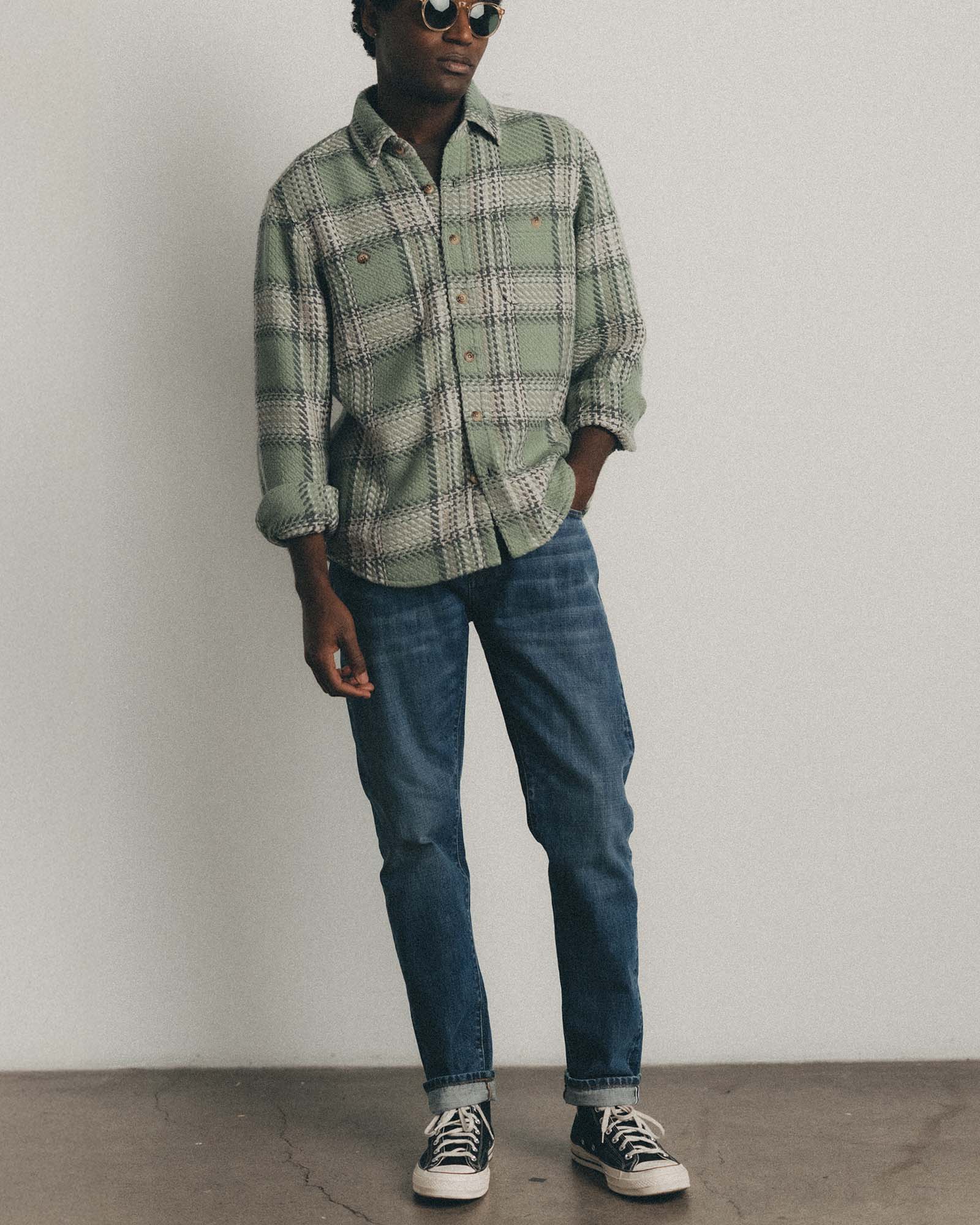 fit model posing in The Cutter Overshirt in Sage Plaid, Wovens by Taylor Stitch