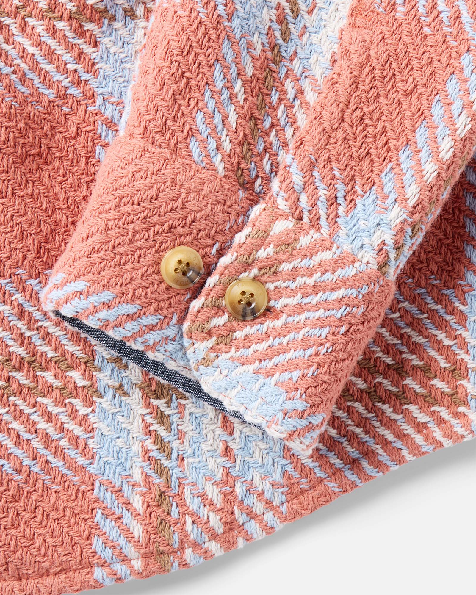 material shot of the sleeve on The Cutter Overshirt in Salmon Plaid, Wovens by Taylor Stitch