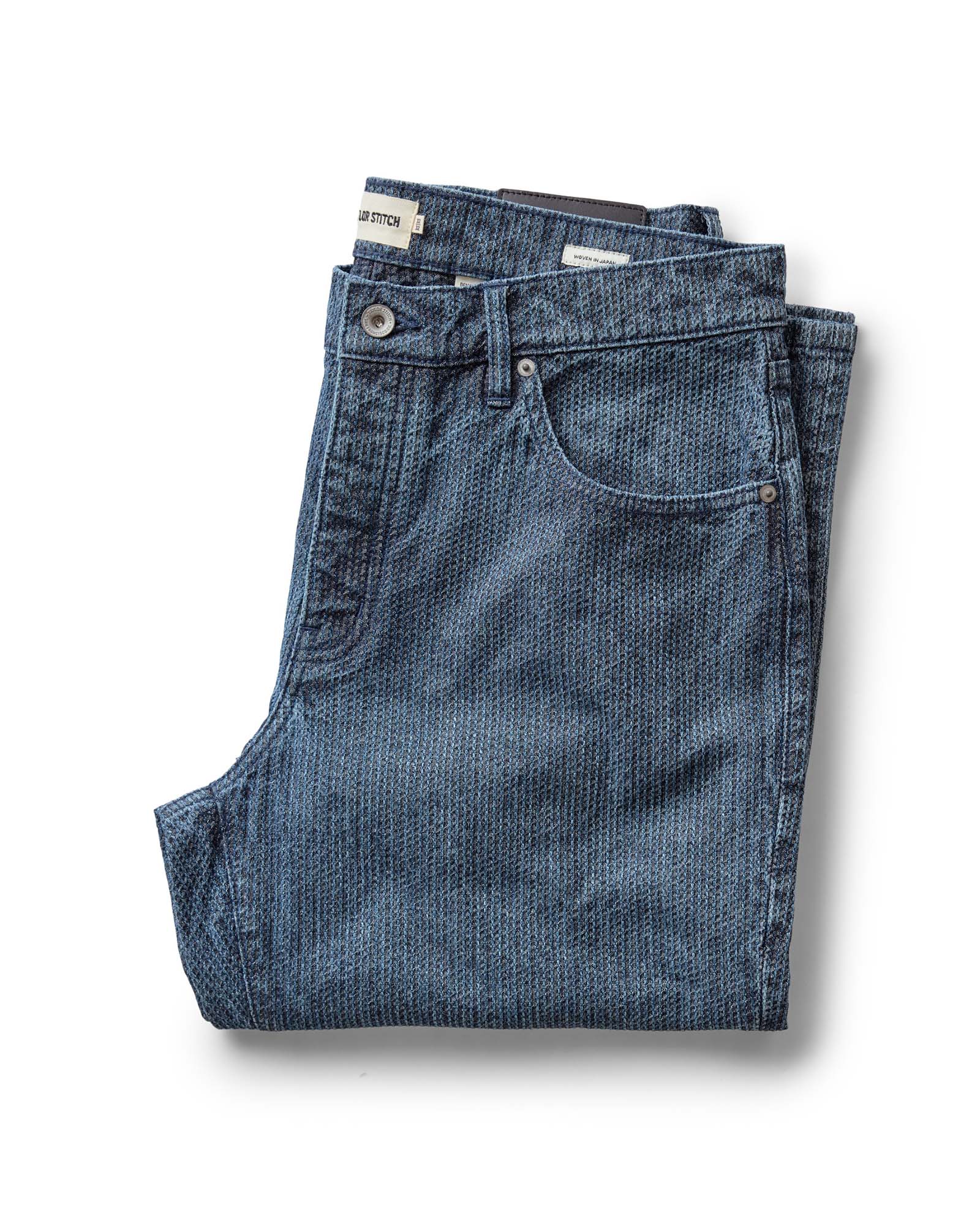 folded flatlay of The Democratic Jean in Japanese Washed Indigo Sashiko, Bottoms by Taylor Stitch