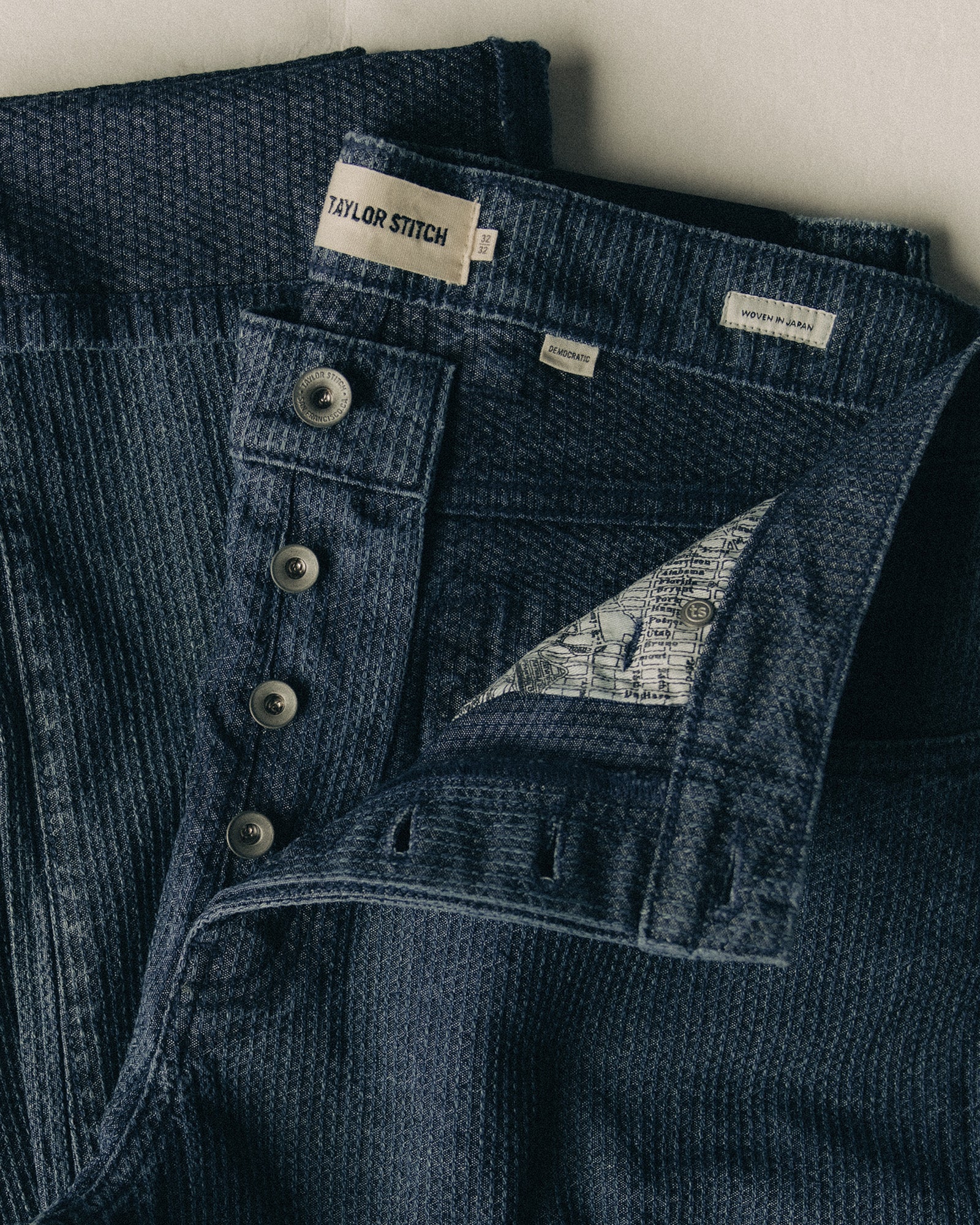 material shot of the buttons on The Democratic Jean in Japanese Washed Indigo Sashiko, Bottoms by Taylor Stitch