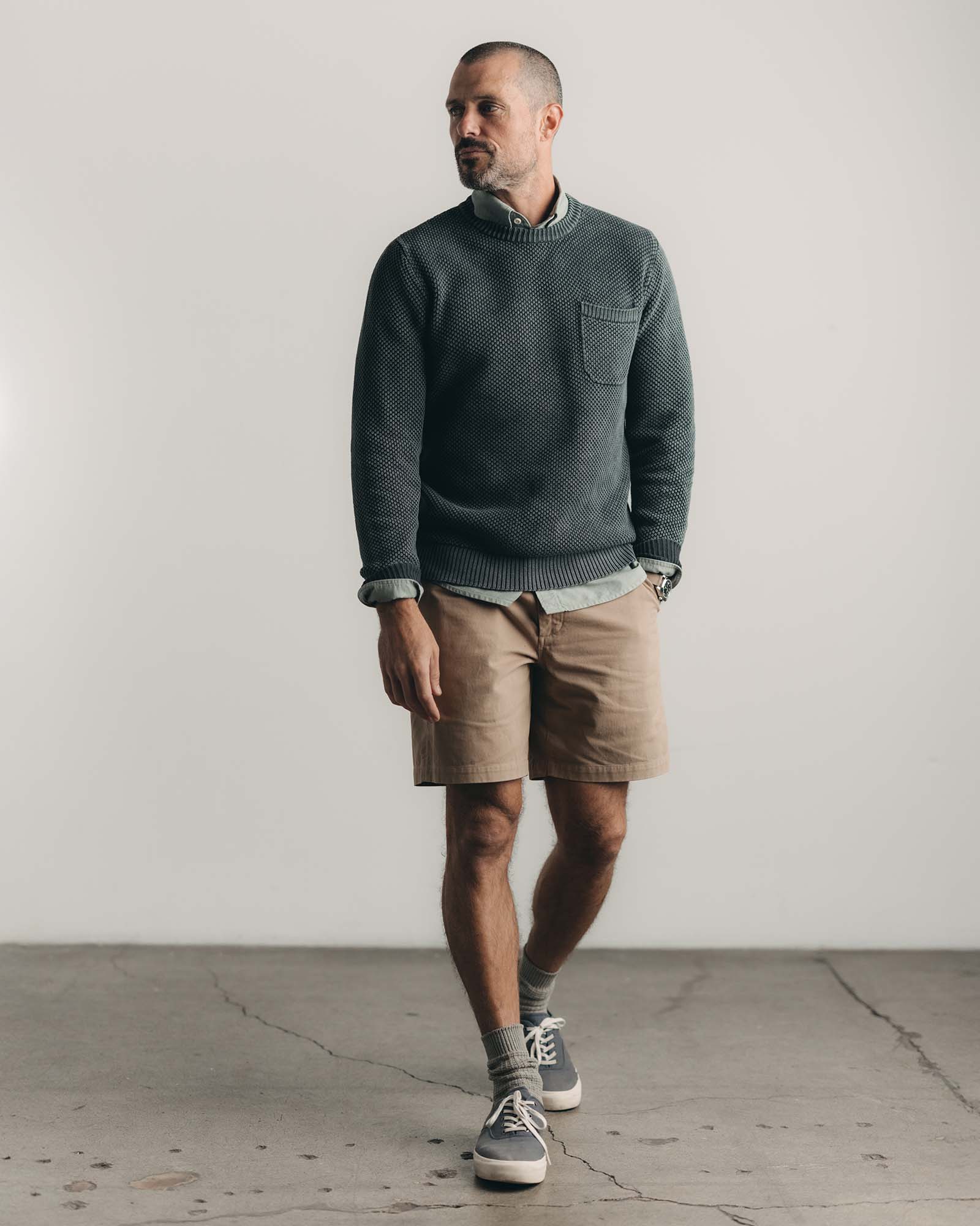fit model walking wearing The Foundation Short in Organic Khaki, Bottoms by Taylor Stitch