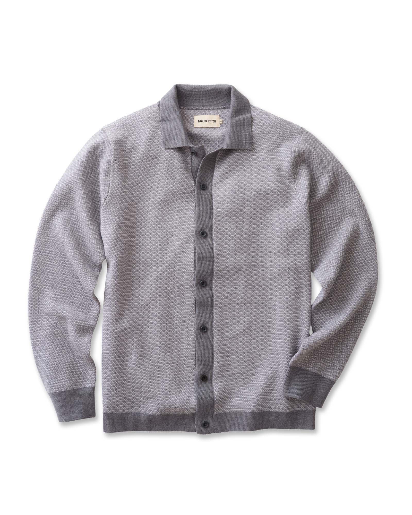 flatlay of The Nichols Polo in Heather Grey Birdseye Merino, Knits by Taylor Stitch