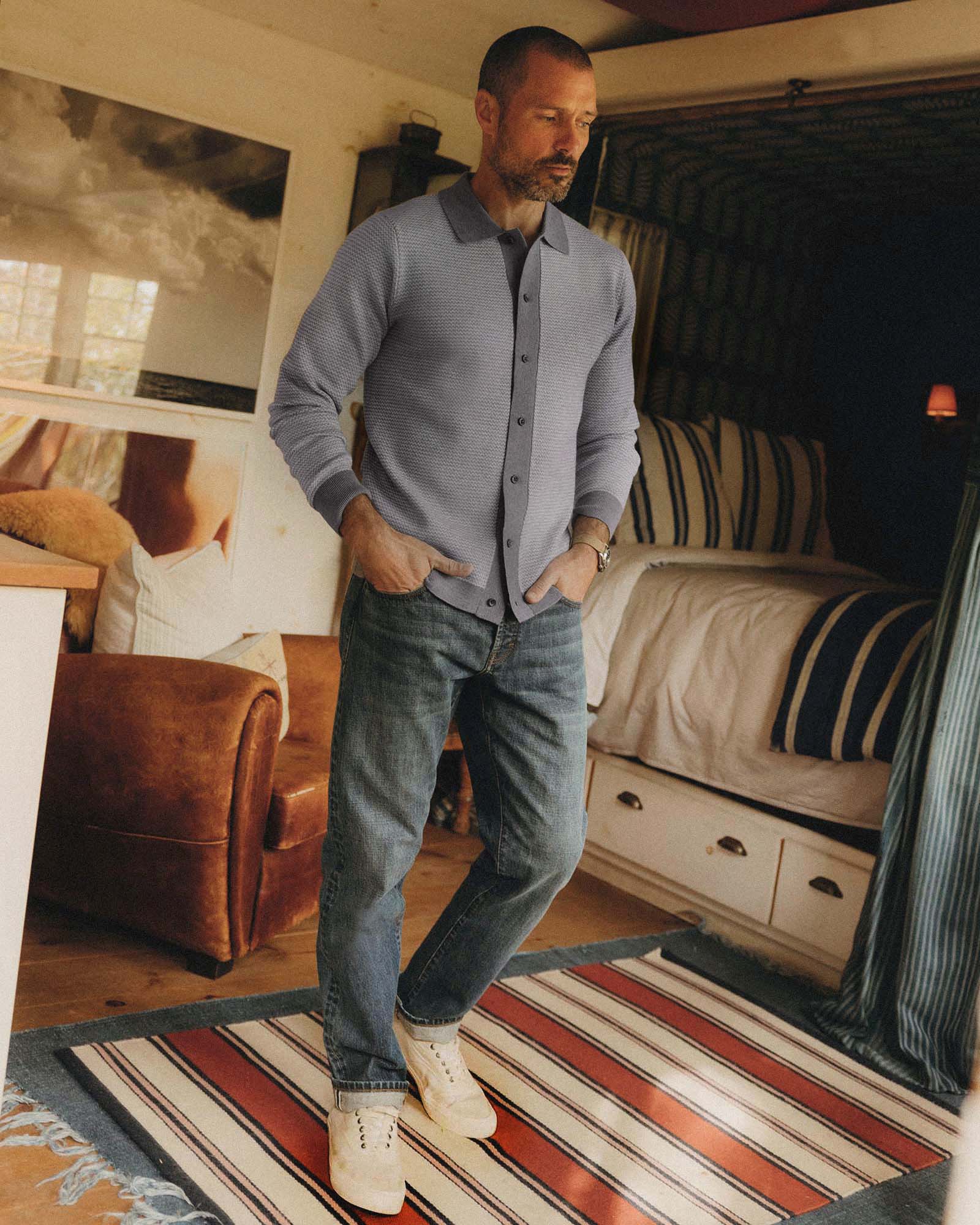 fit model walking wearing The Nichols Polo in Heather Grey Birdseye Merino, Knits by Taylor Stitch