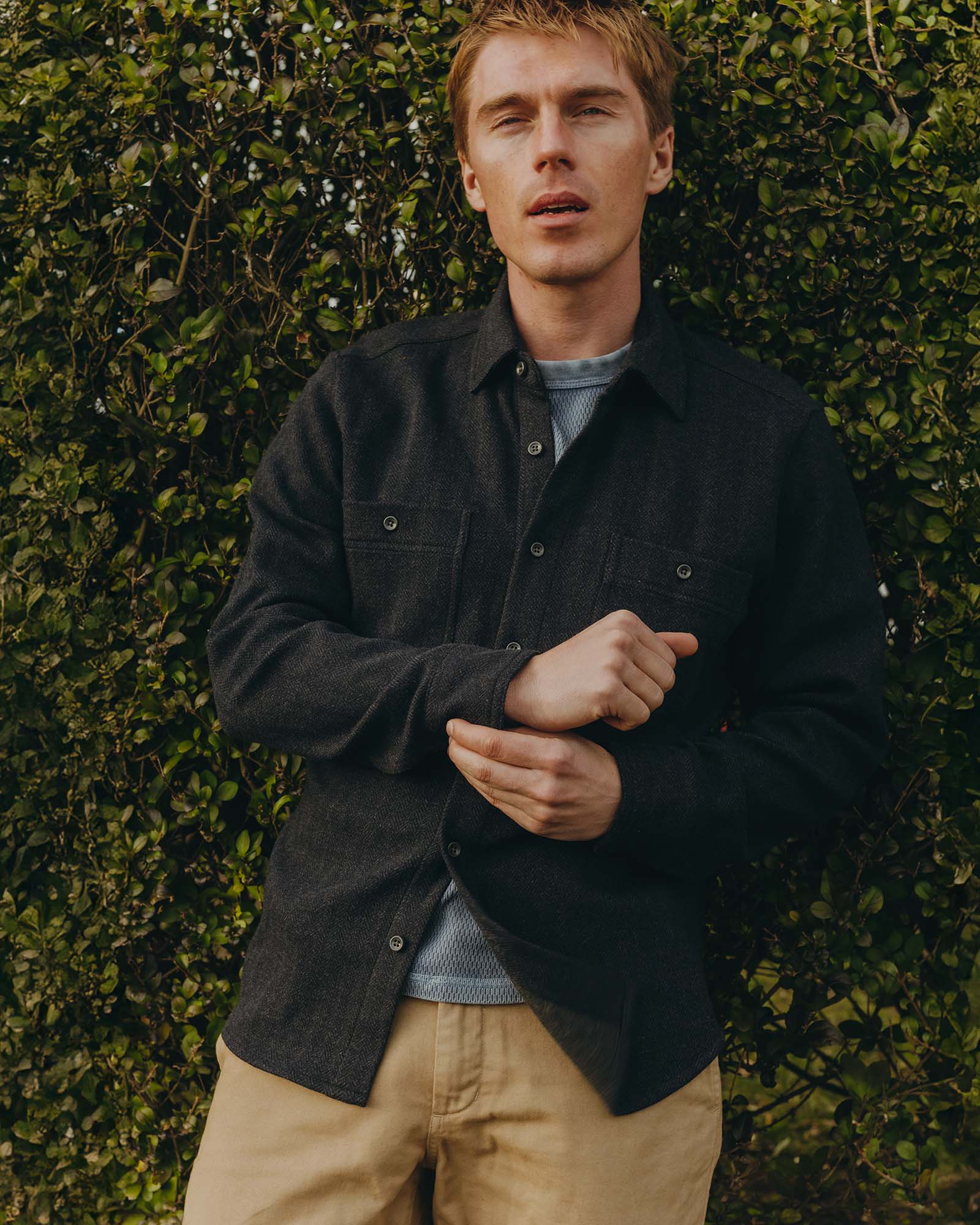 fit model showing off The North Shore Knit Shirt in Heather Navy, Knits by Taylor Stitch