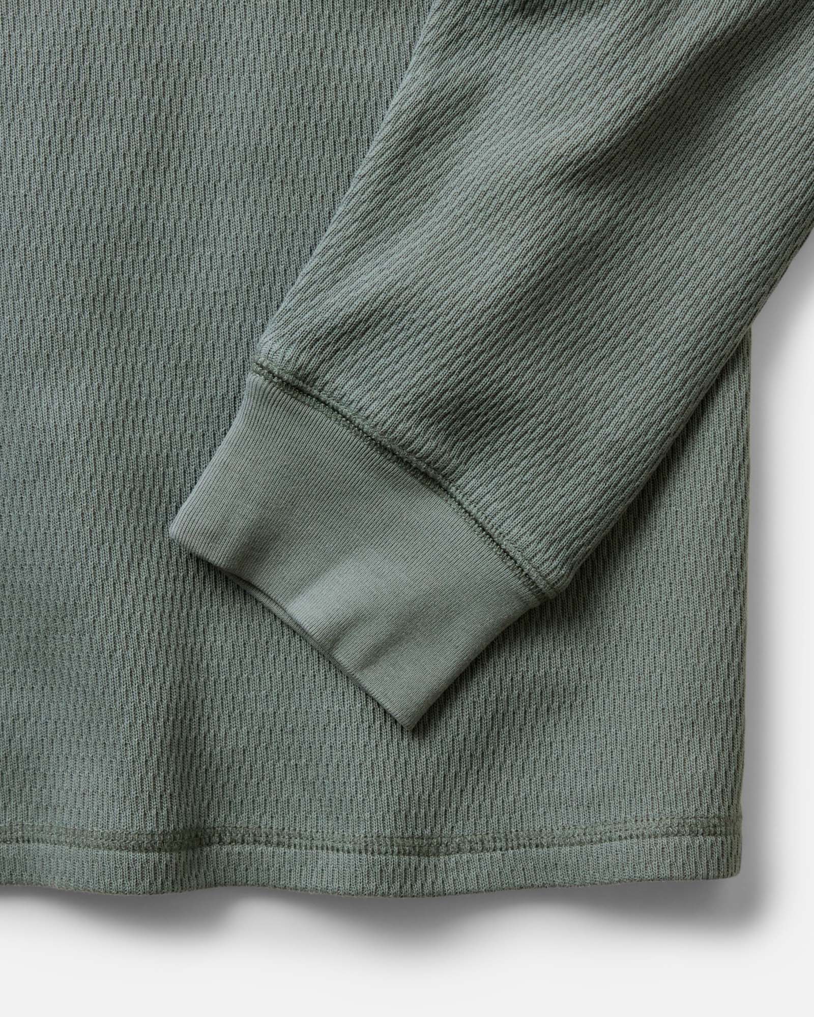 material shot of the sleeves on The Organic Cotton Crew in Deep Sea Waffle, Knits by Taylor Stitch