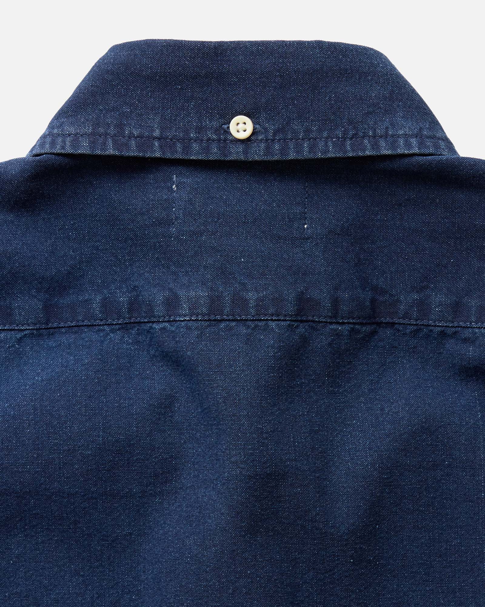 material shot of the back collar on The Short Sleeve Jack in Rinsed Indigo Oxford, Wovens by Taylor Stitch