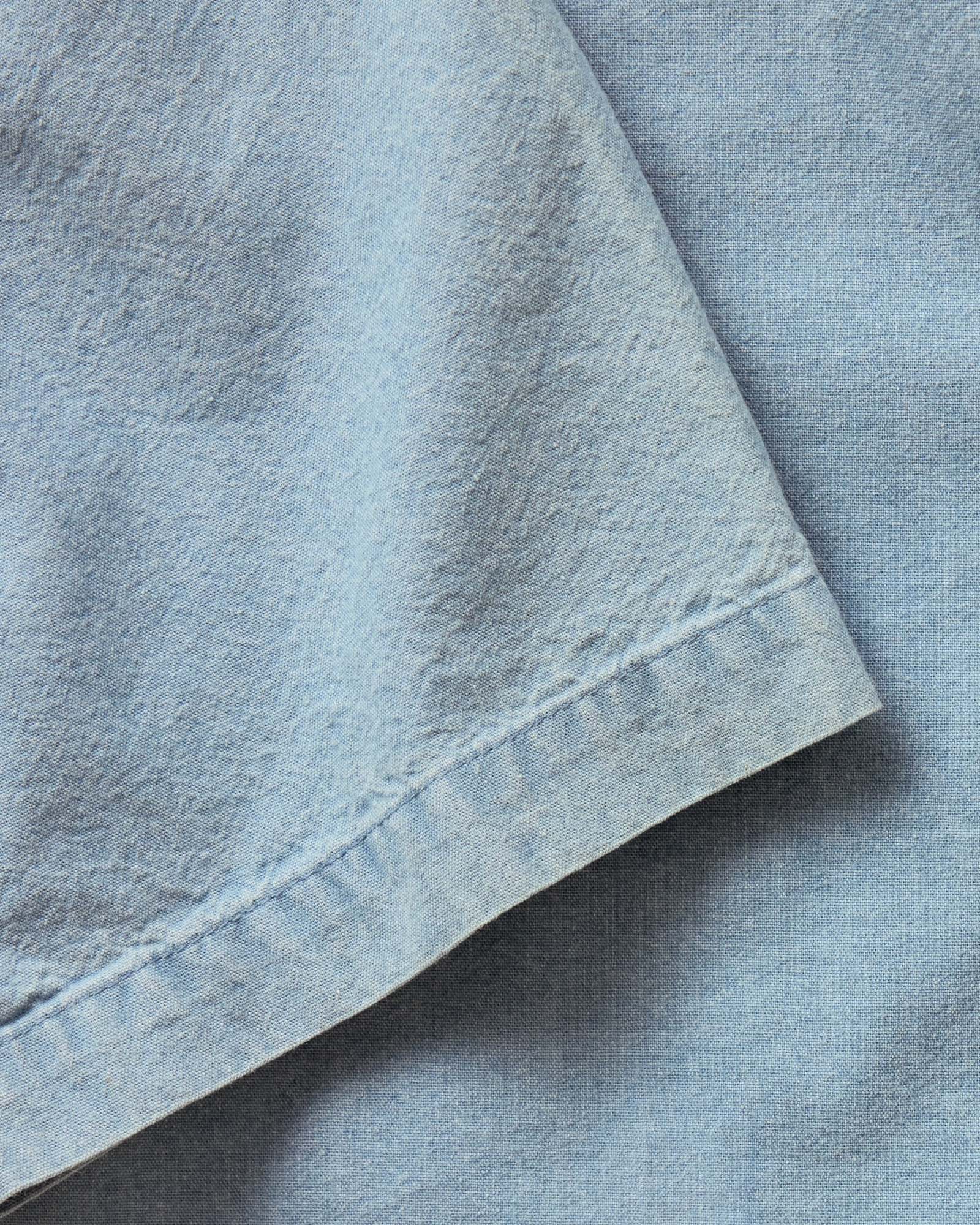 material shot of the sleeve on The Short Sleeve Jack in Washed Indigo Oxford, Wovens by Taylor Stitch