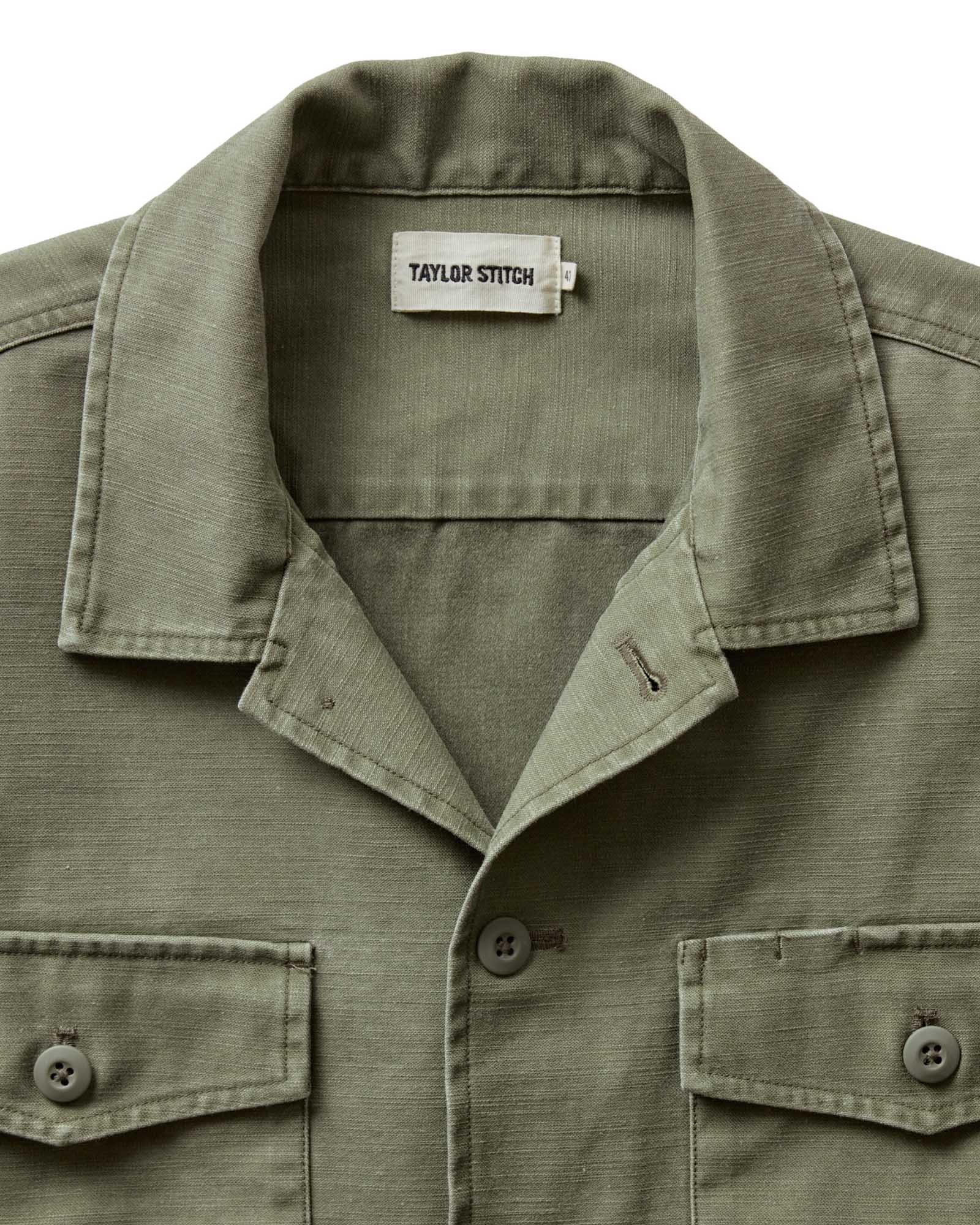 material shot of the collar on The Short Sleeve Surplus Shirt in Field Olive Reverse Sateen, Wovens by Taylor Stitch