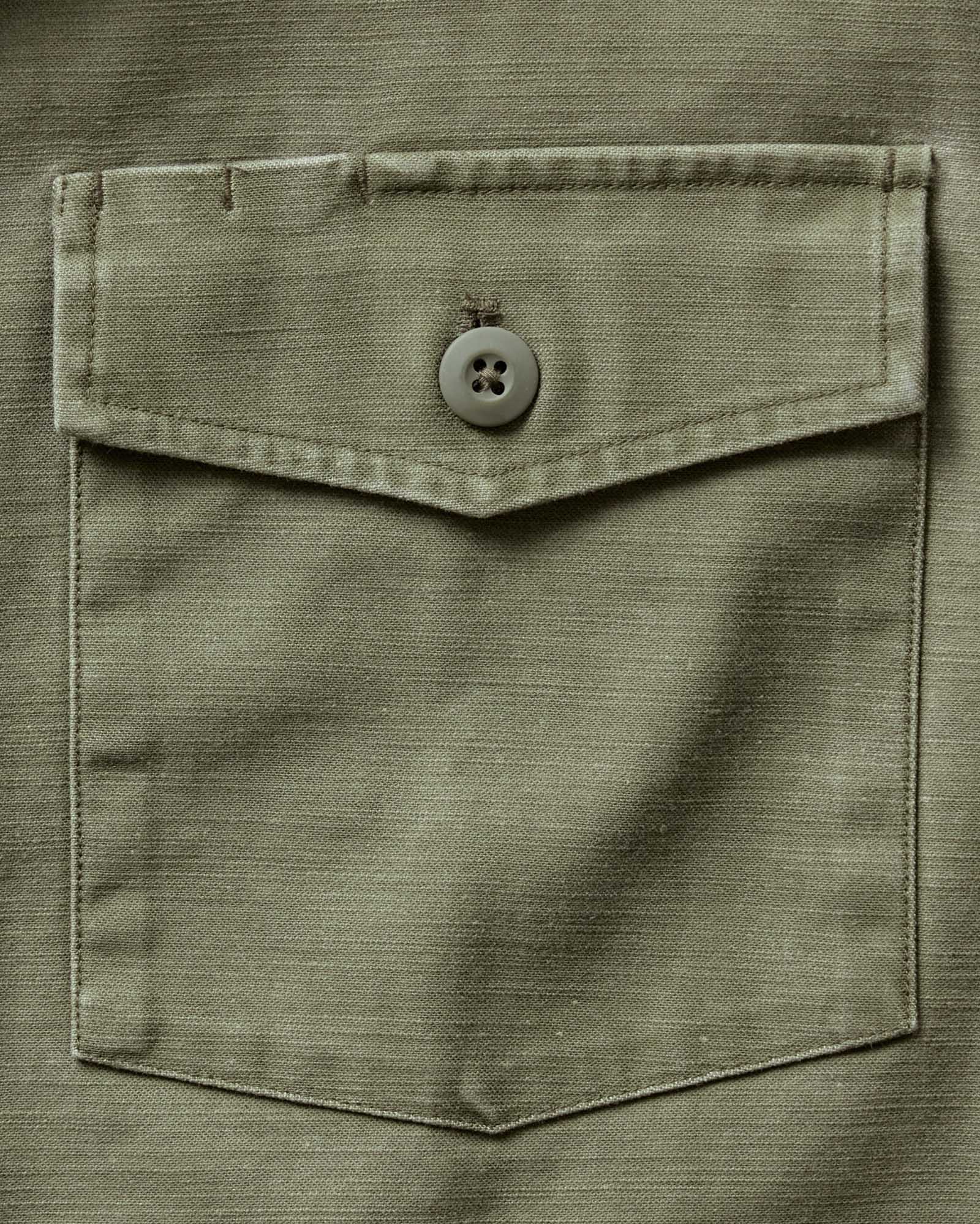 material shot of the pocket on The Short Sleeve Surplus Shirt in Field Olive Reverse Sateen, Wovens by Taylor Stitch
