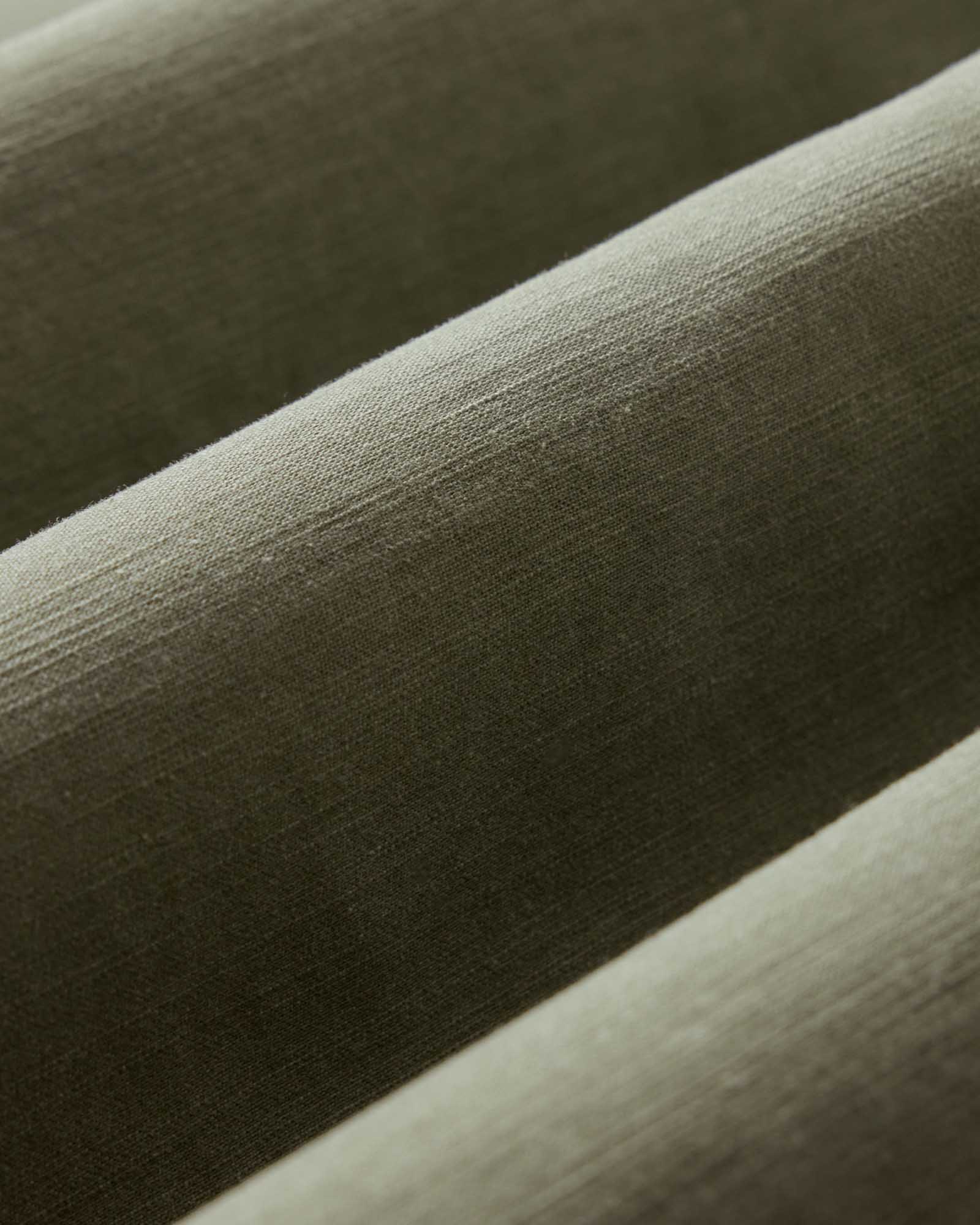 material shot of the fabric on The Short Sleeve Surplus Shirt in Field Olive Reverse Sateen, Wovens by Taylor Stitch