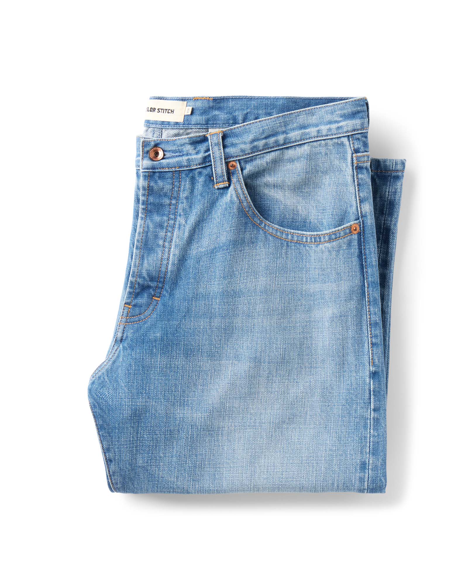 folded flatlay of The Straight Jean in Light Wash Organic Selvedge, Bottoms by Taylor Stitch