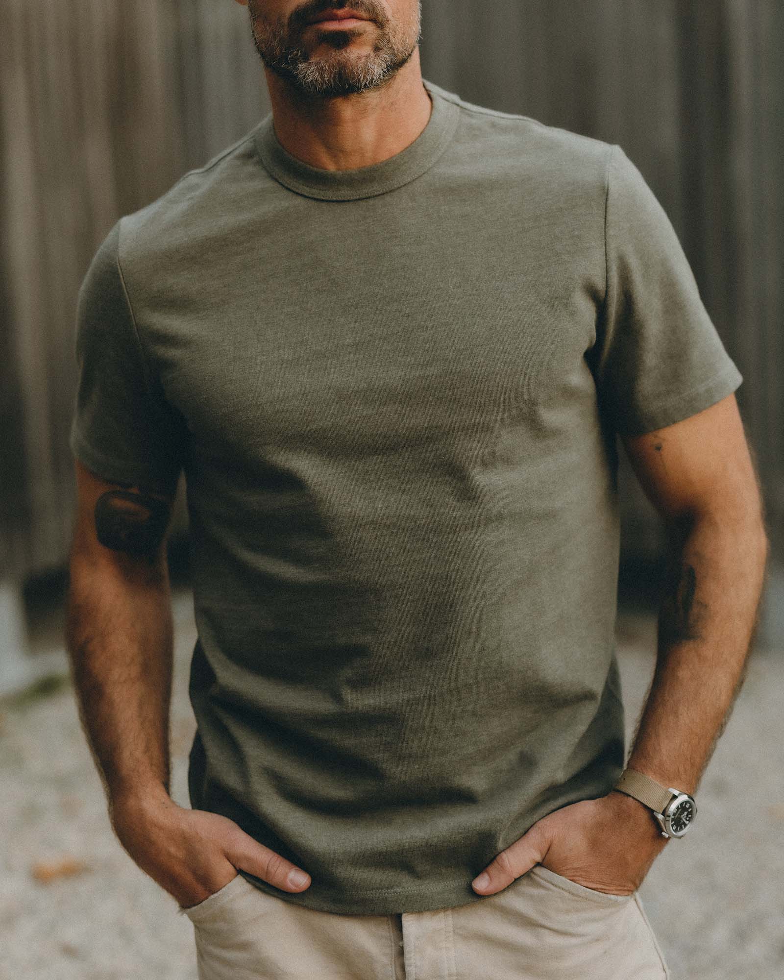 fit model posing wearing The Organic Cotton Shop Tee in Army Twist, Knits by Taylor Stitch
