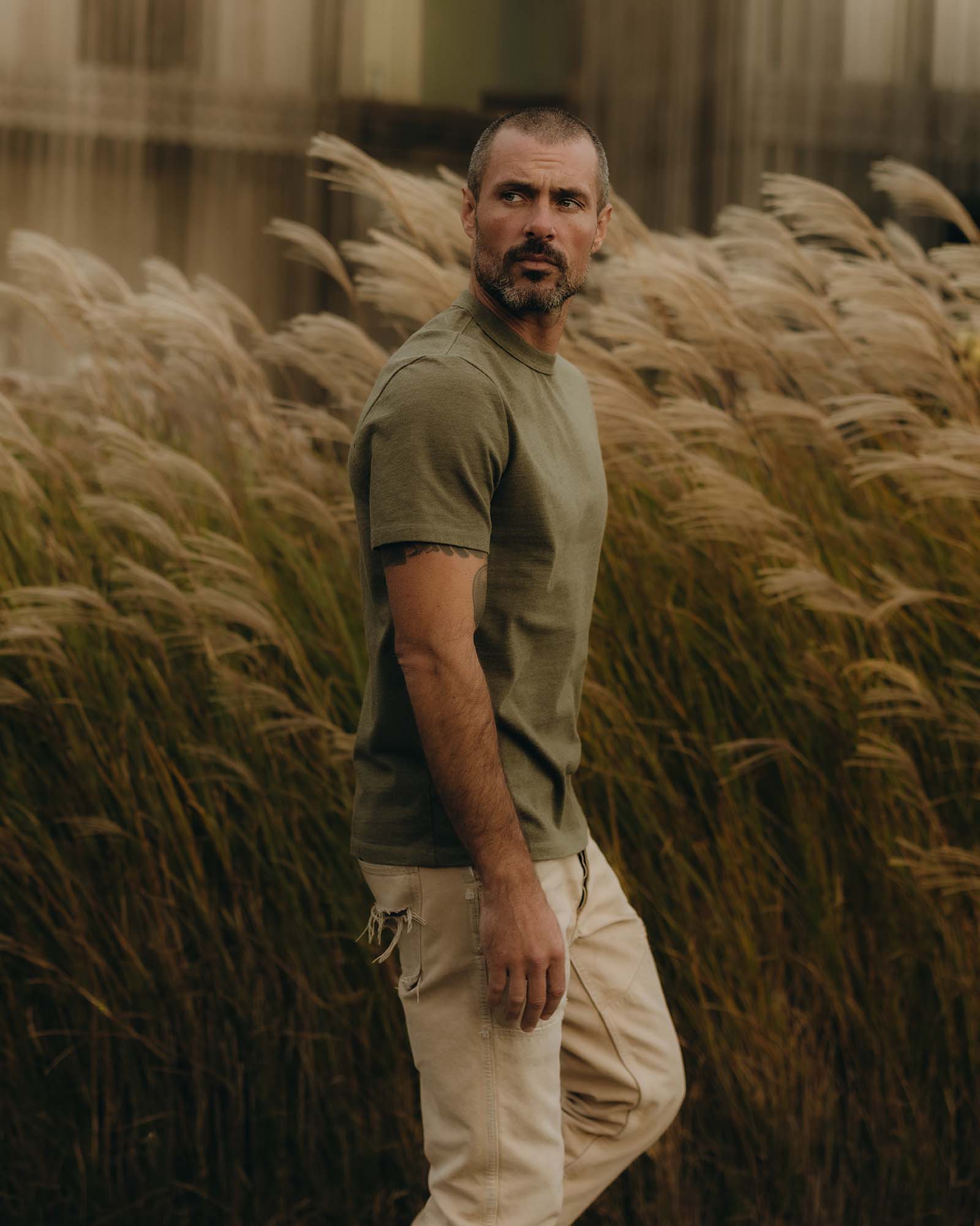 fit model showing off the sleeves on The Organic Cotton Shop Tee in Army Twist, Knits by Taylor Stitch
