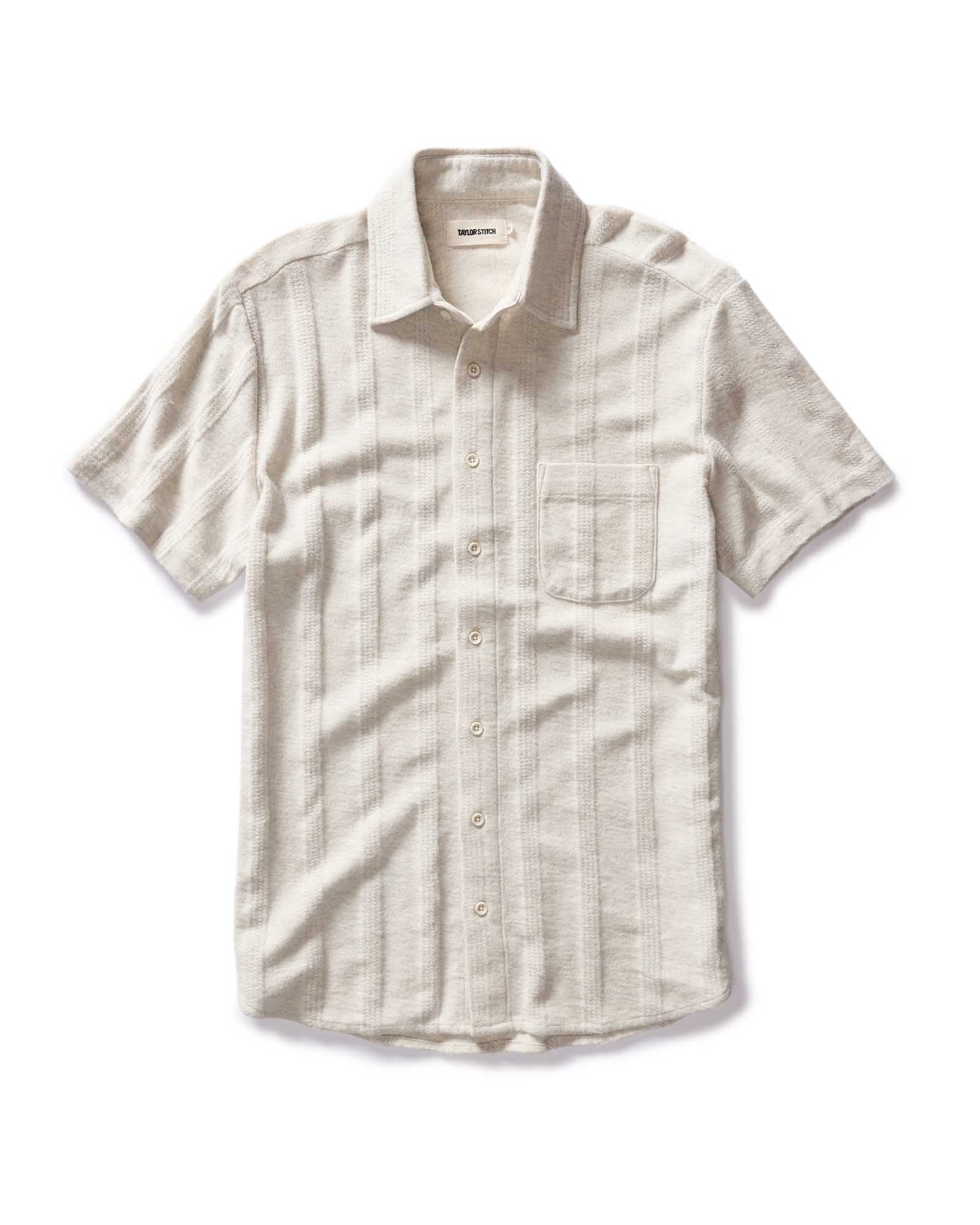 flatlay of The Short Sleeve California in Heather Ash Pointelle Stripe, Knits by Taylor Stitch