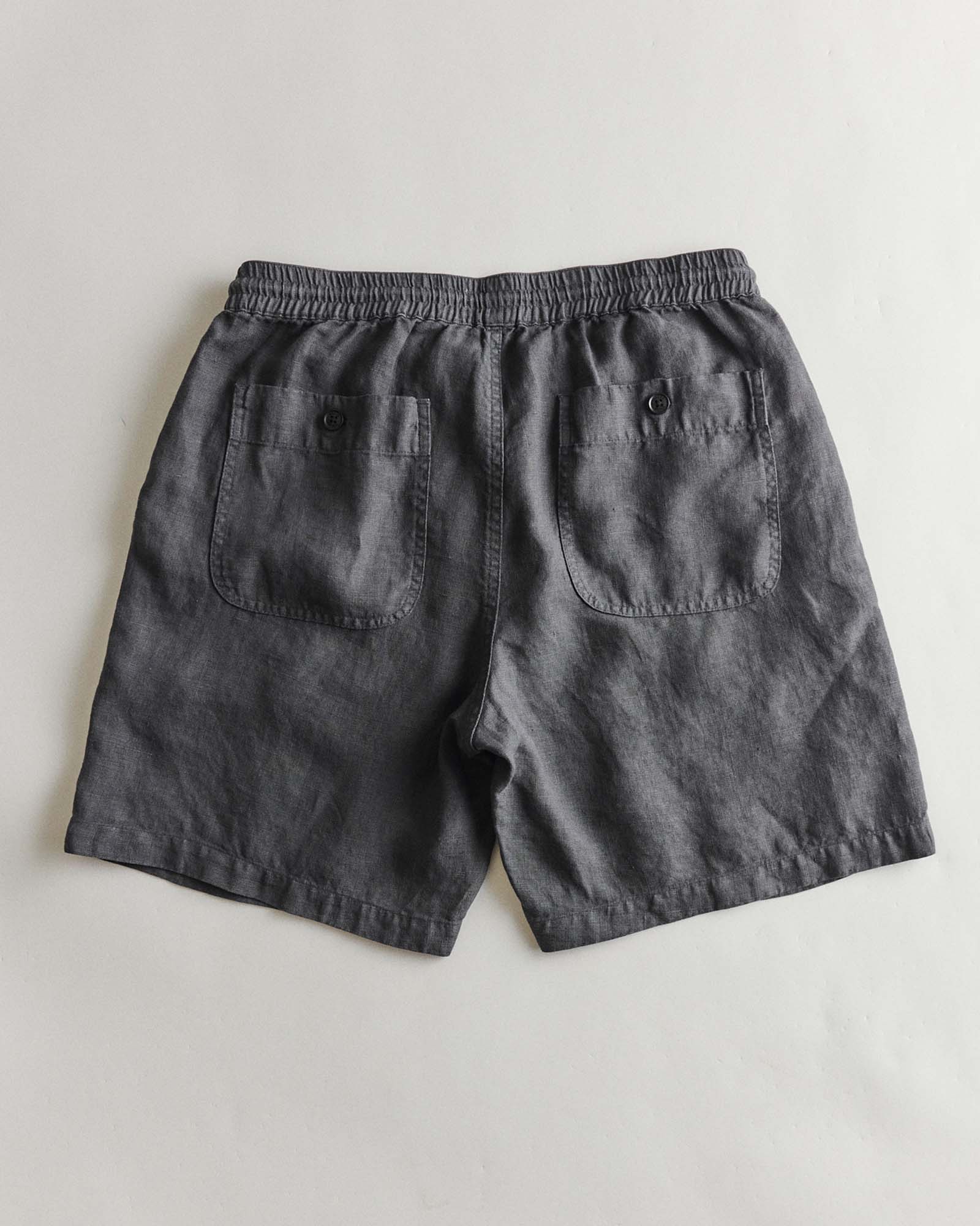flatlay of the back of The Apres Short in Faded Black Hemp, Bottoms by Taylor Stitch