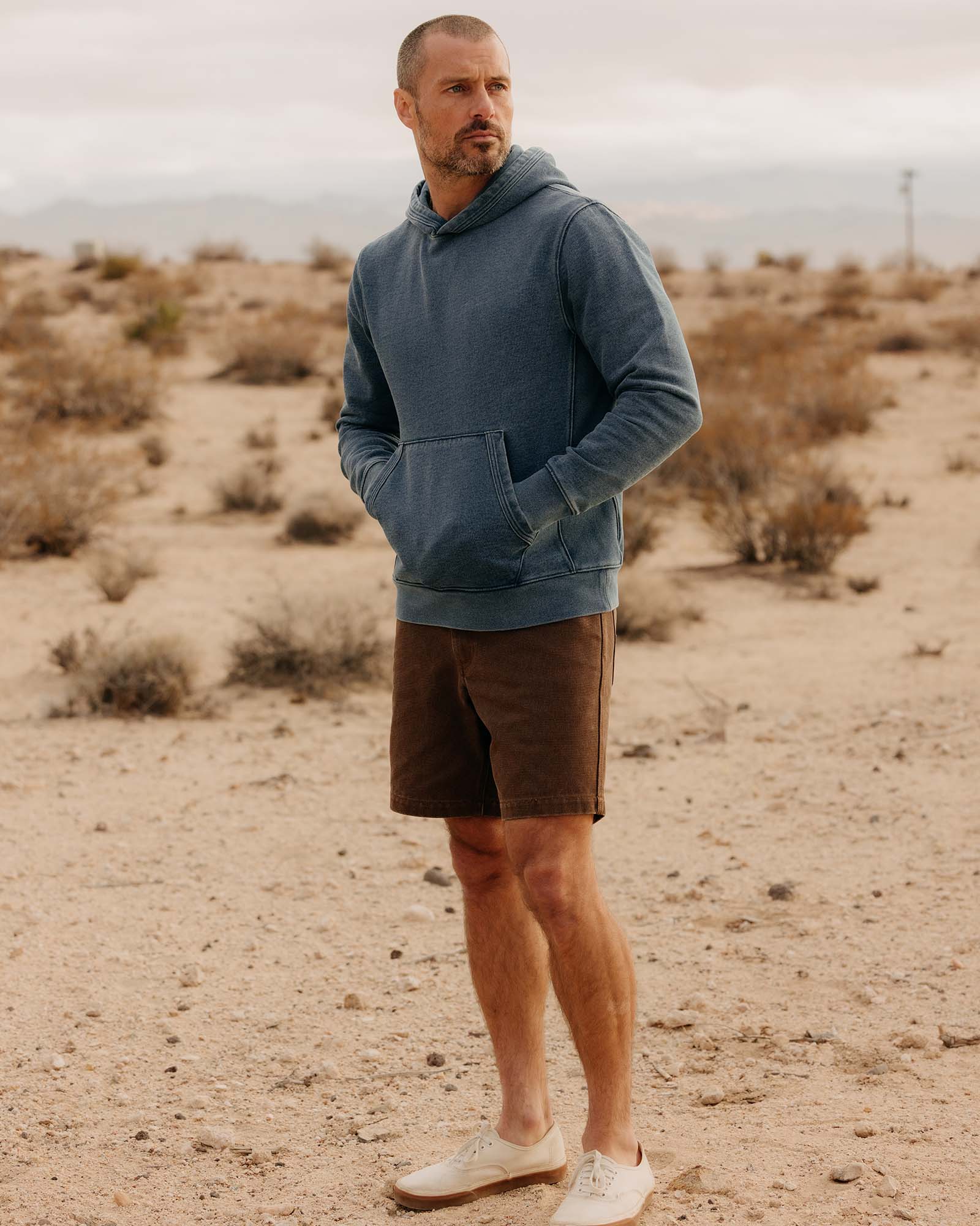 fit model standing wearing The Apres Hoodie in Washed Indigo Terry, Knits by Taylor Stitch