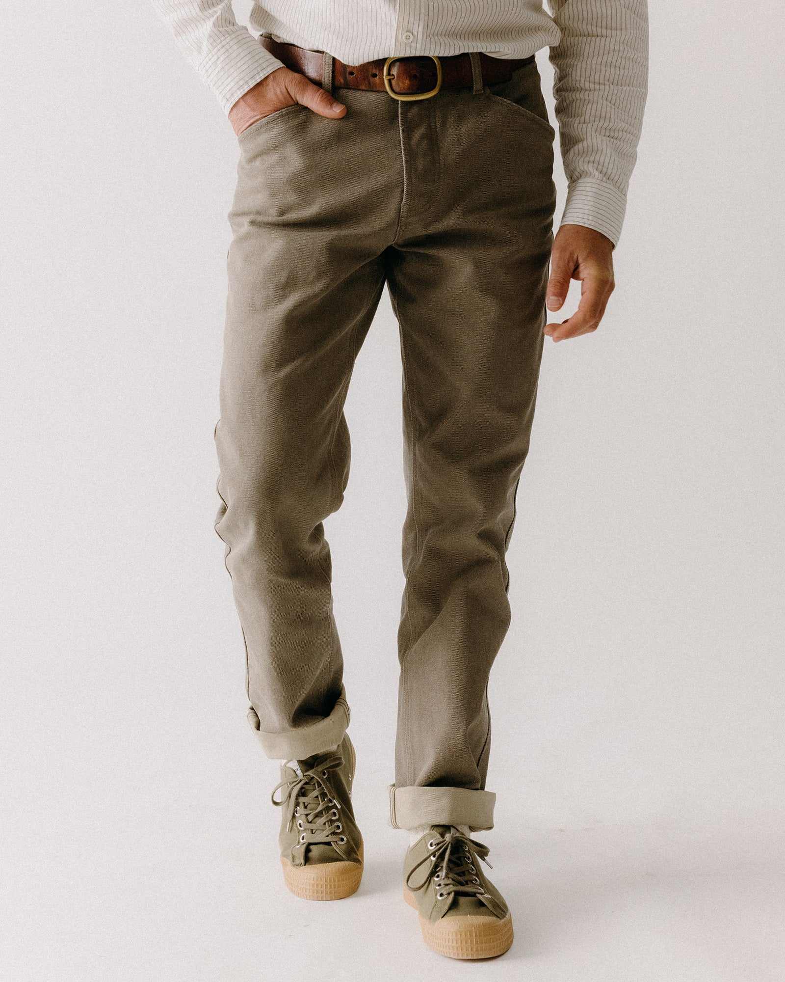 fit model with his hands in the pockets of The Camp Pant in Stone Chipped Canvas, Bottoms by Taylor Stitch