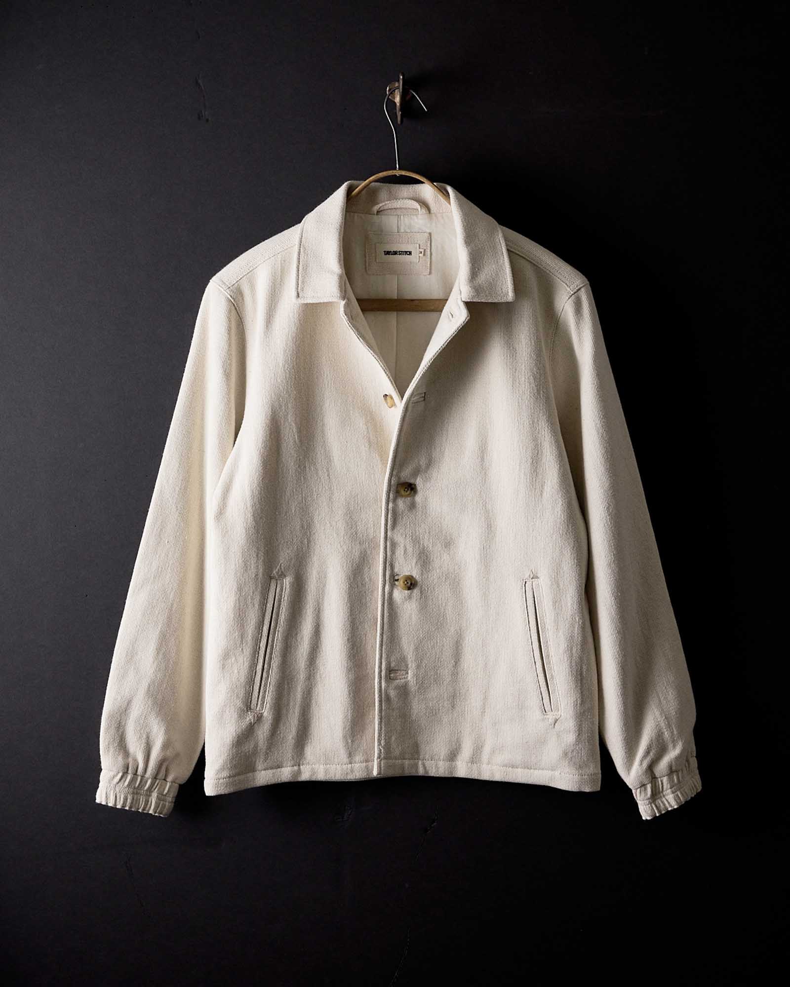 editorial image of The Crew Jacket in Seeded Natural Sashiko hanging, Outerwear by Taylor Stitch