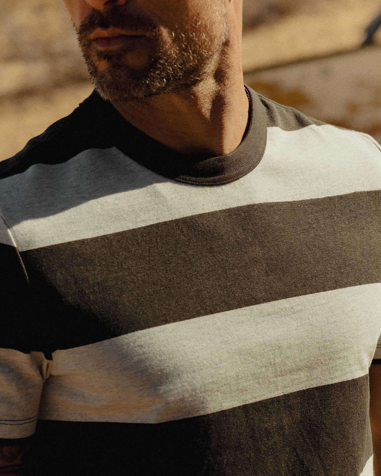 fit model showing off The Organic Cotton Shop Tee in Faded Black Stripe, Knits by Taylor Stitch