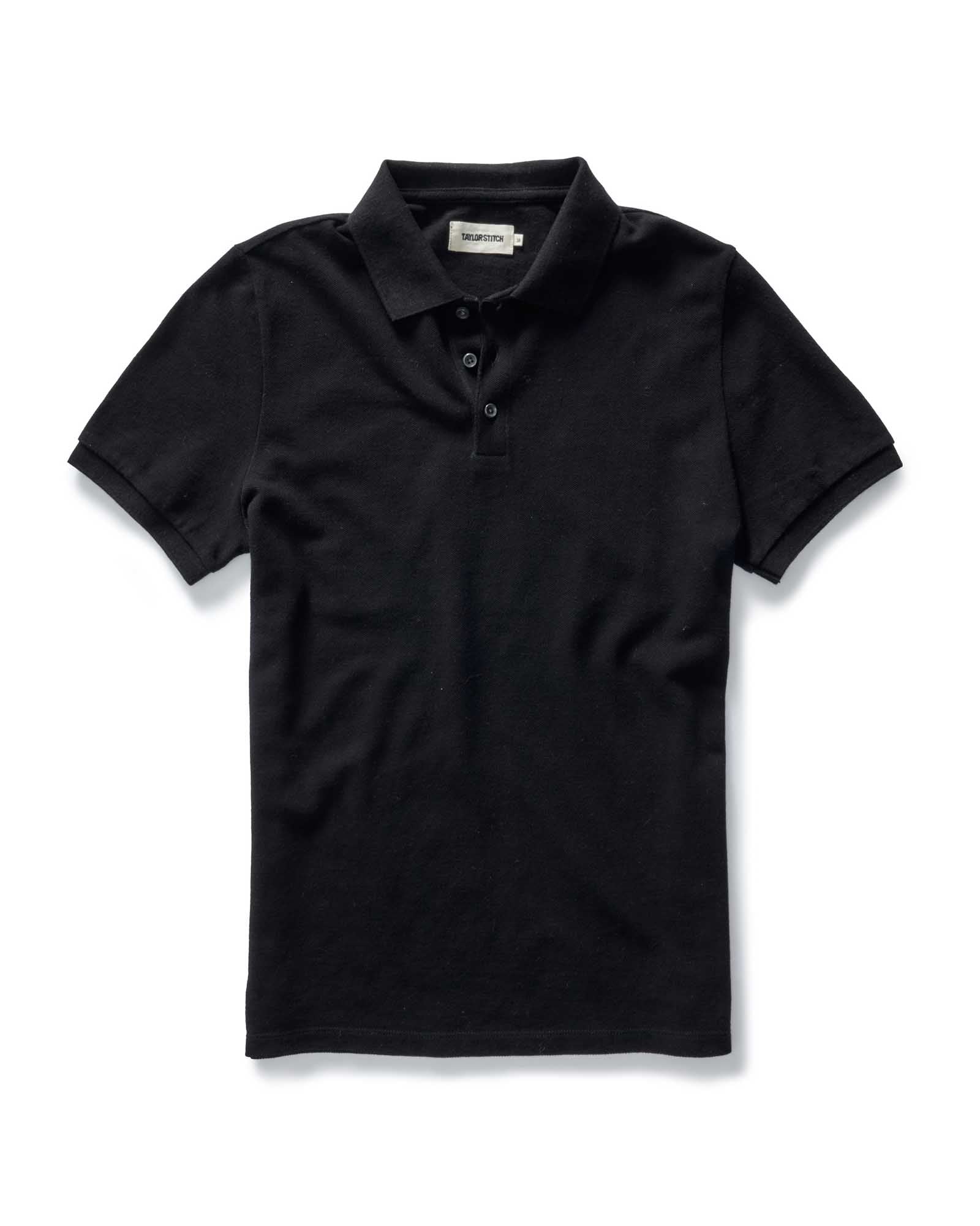 flatlay of The Pacific Polo in Black Indigo Pique, Knits by Taylor Stitch