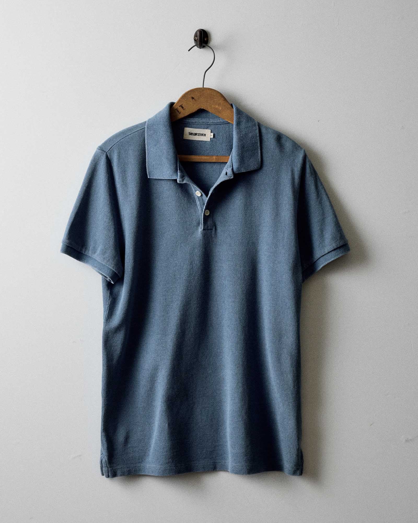 editorial image of The Pacific Polo in Washed Indigo Pique hanging, Knits by Taylor Stitch