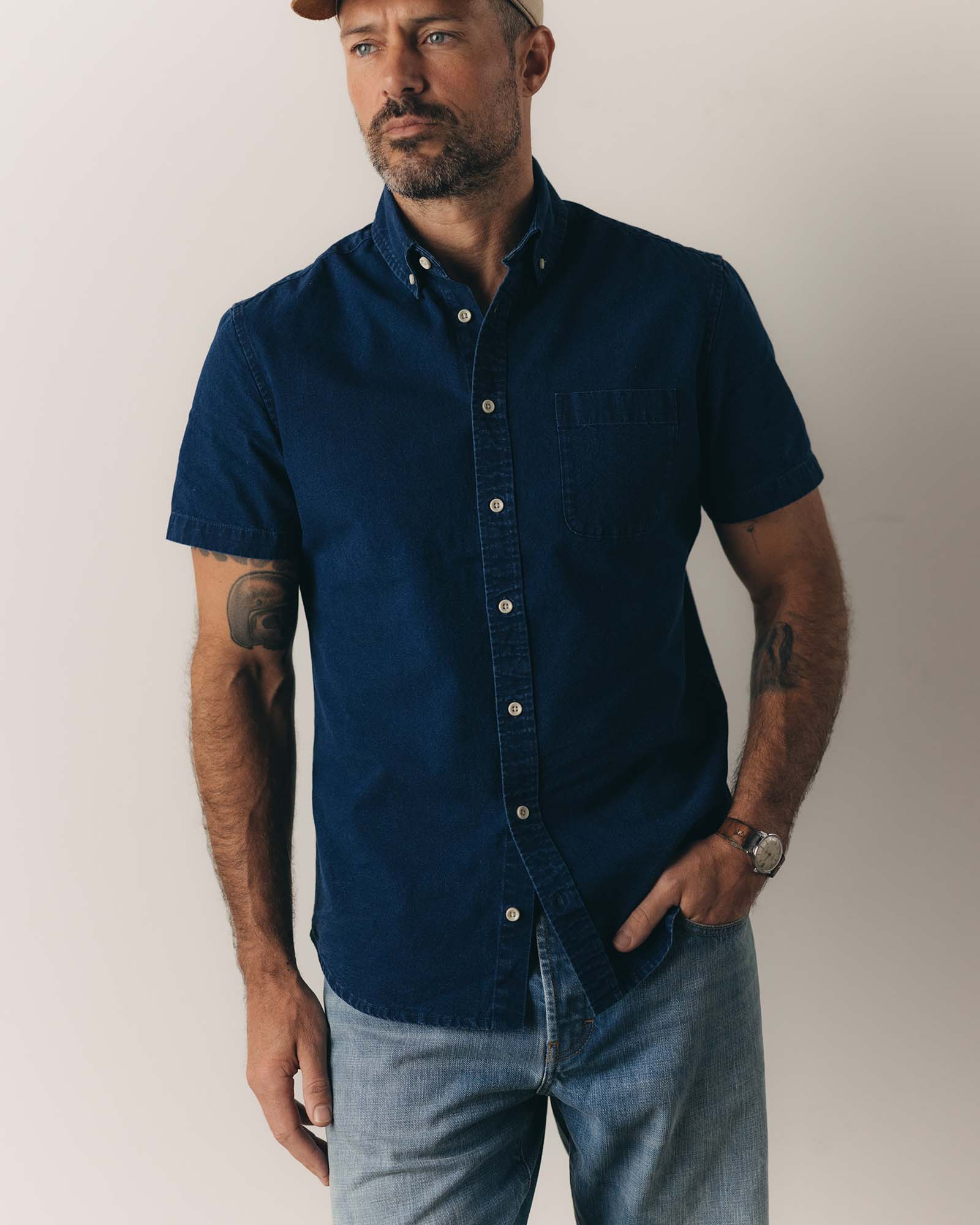 fit model posing in The Short Sleeve Jack in Rinsed Indigo Oxford, Wovens by Taylor Stitch