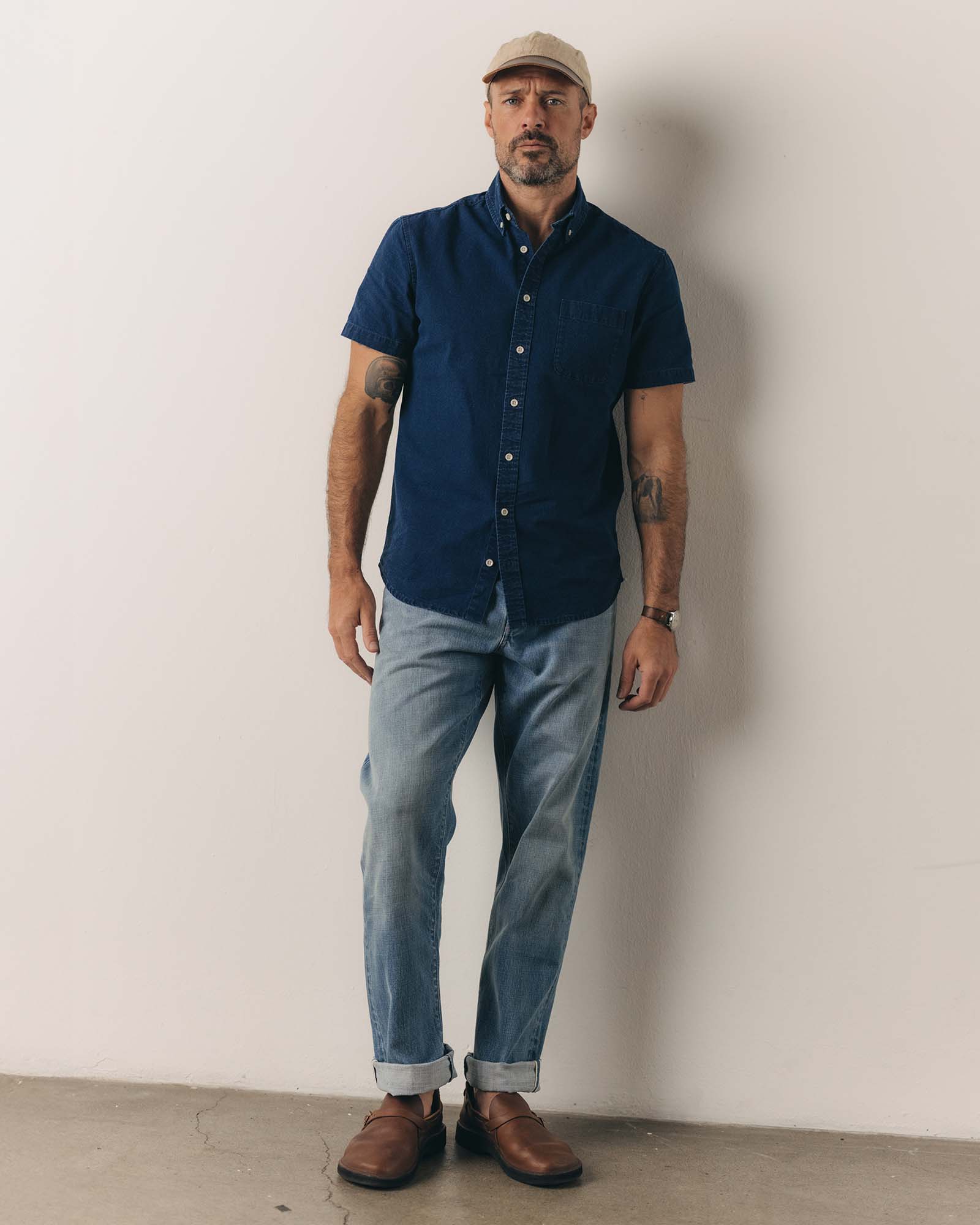 fit model showing off The Short Sleeve Jack in Rinsed Indigo Oxford, Wovens by Taylor Stitch