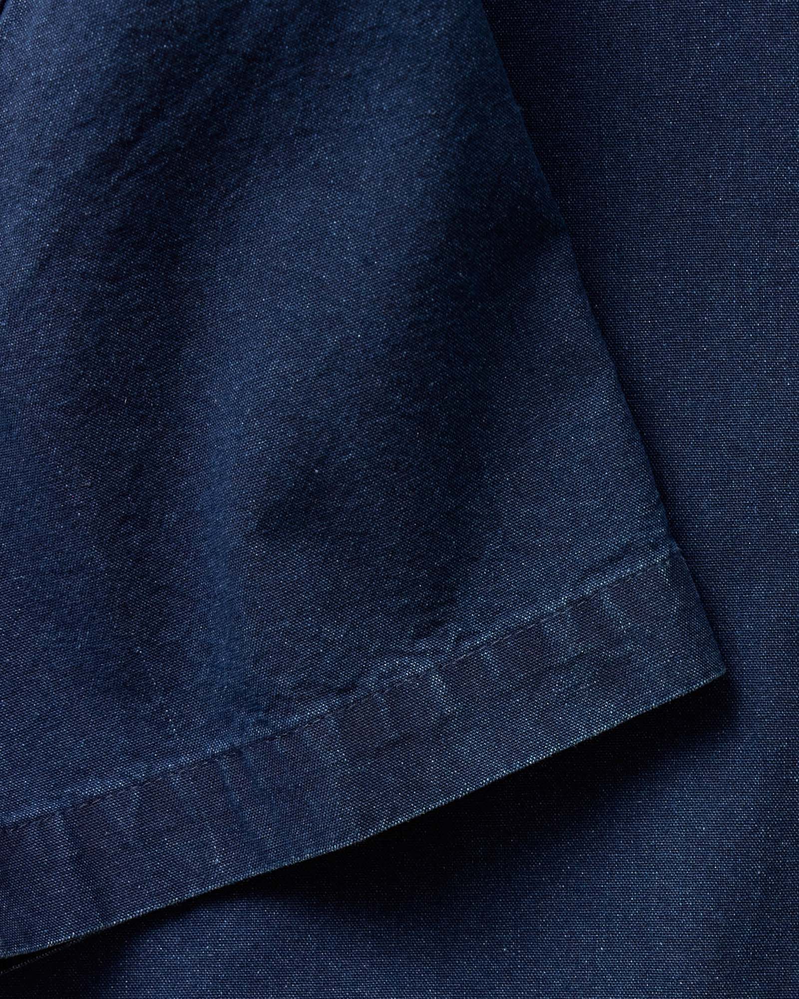 editorial image of The Short Sleeve Jack in Rinsed Indigo Oxford hanging, Wovens by Taylor Stitch