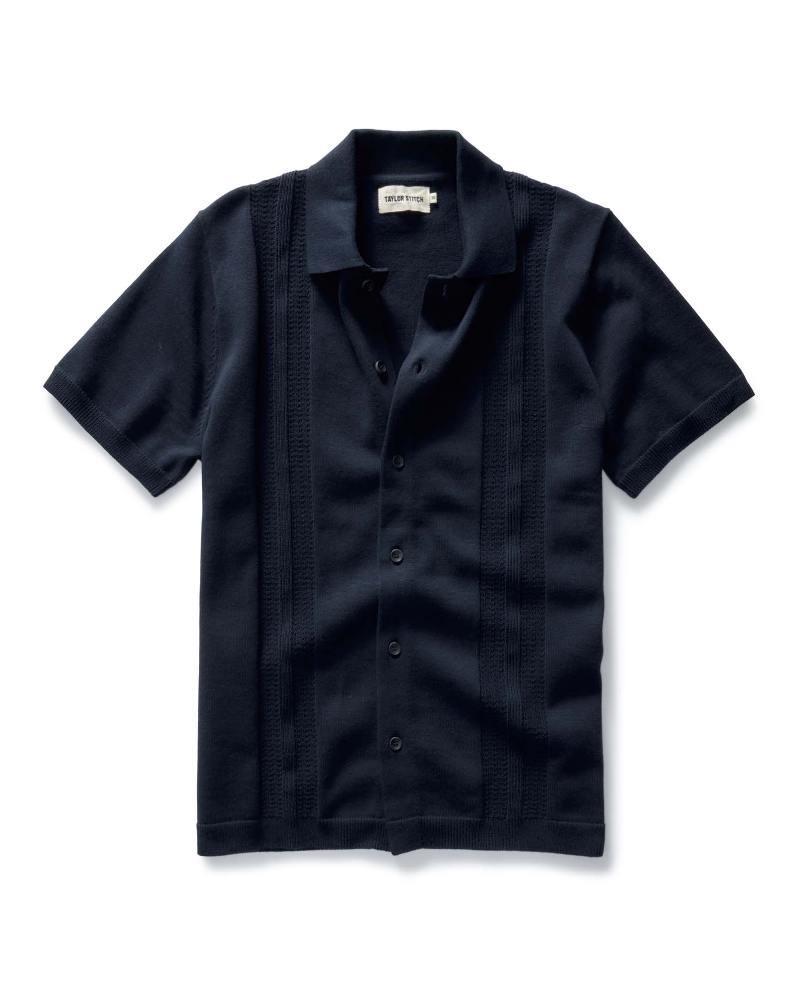 flatlay of The Button Down Polo in Dark Navy Stripe, Knits by Taylor Stitch