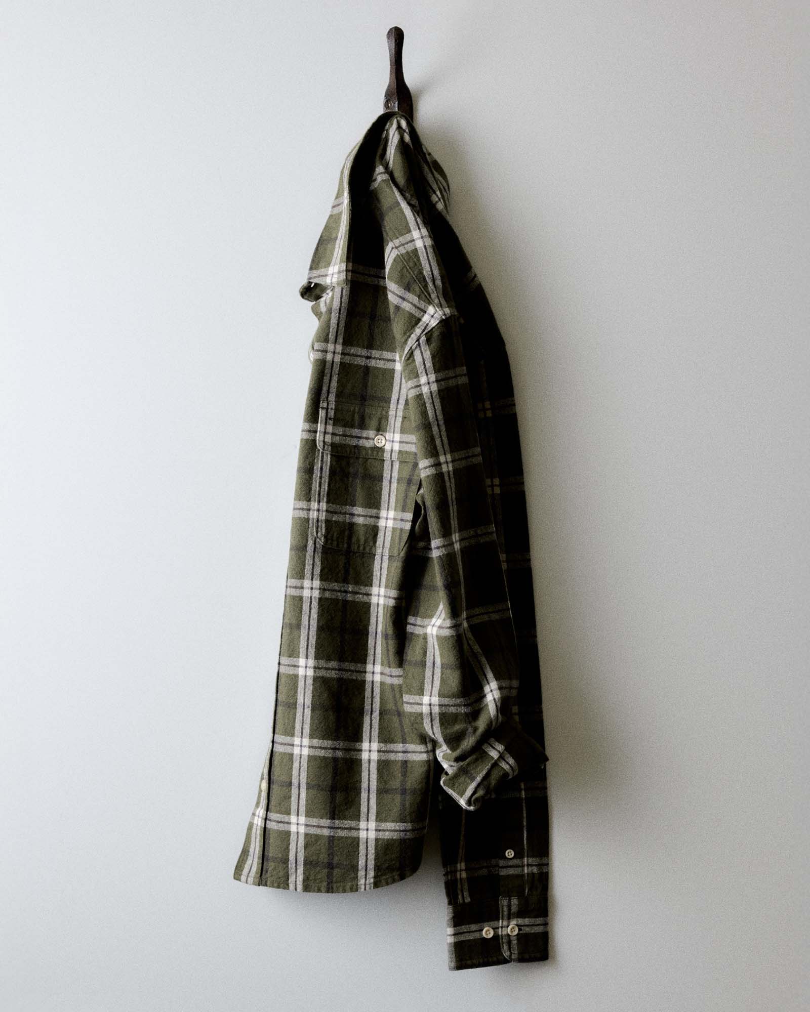 editorial image of The Craftsman Shirt in Canteen Plaid Linen hanging, Wovens by Taylor Stitch