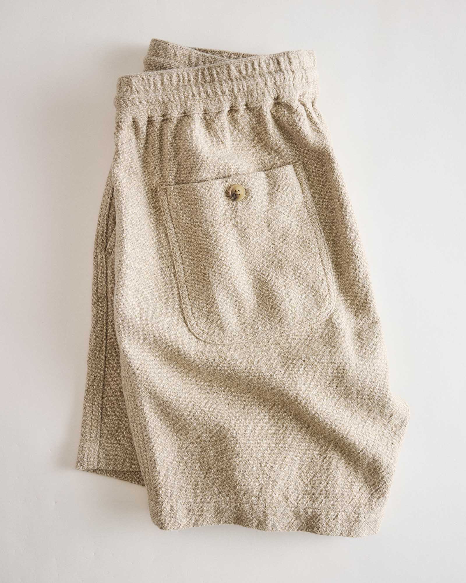 flatlay of the back of The Apres Short in Oat Linen Tweed, Bottoms by Taylor Stitch
