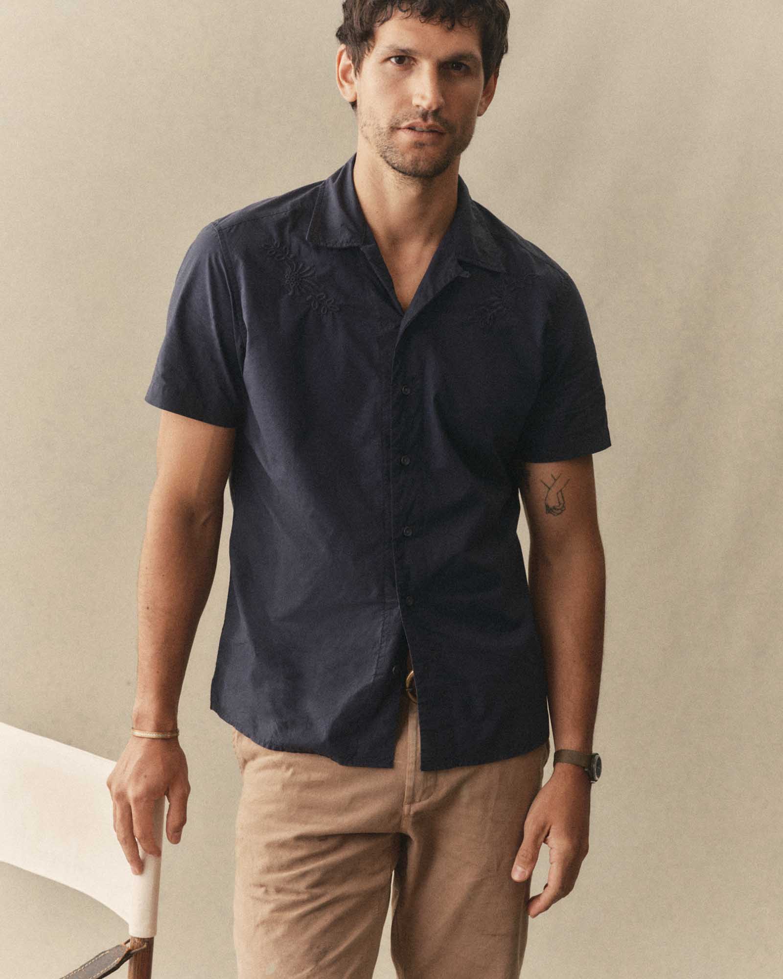 fit model posing in The Davis Shirt in Navy Floral Embroidery, Wovens by Taylor Stitch