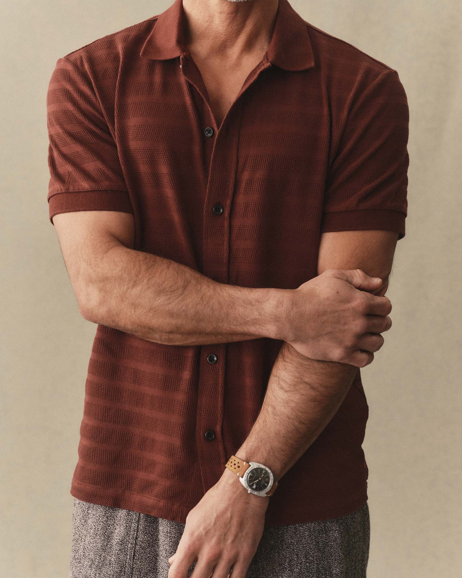 fit model posing in The Bywater Polo in Burgundy Knit Stripe, Knits by Taylor Stitch