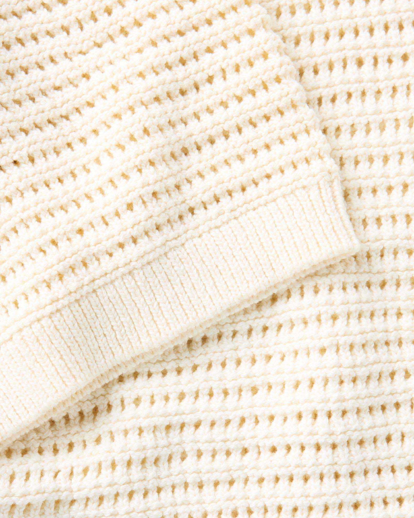material shot of the sleeve on The Monterey Sweater Polo in Vintage White Crochet, Knits by Taylor Stitch