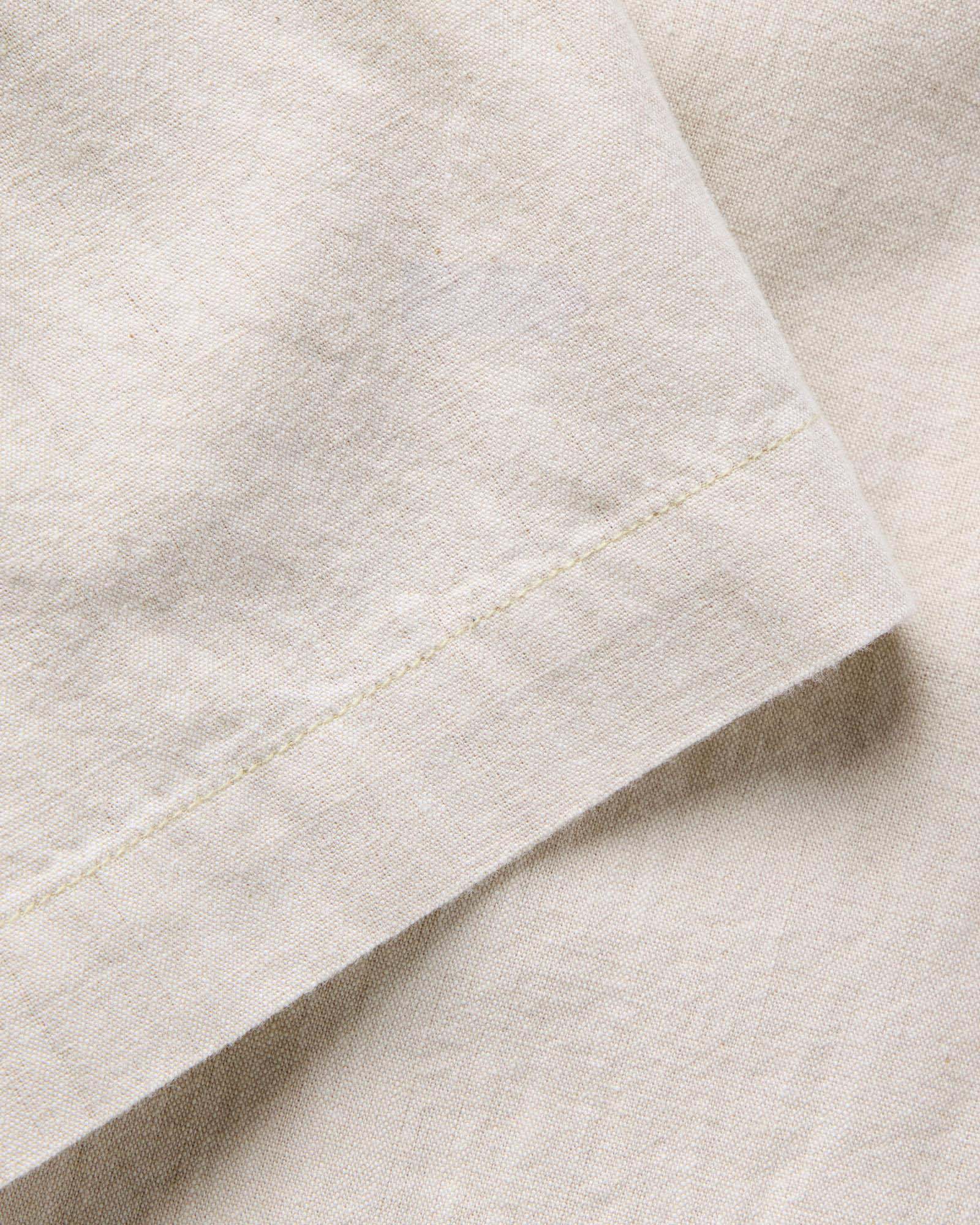 material shot of the sleeve on The Short Sleeve Crew Shirt in Natural Chambray, Wovens by Taylor Stitch