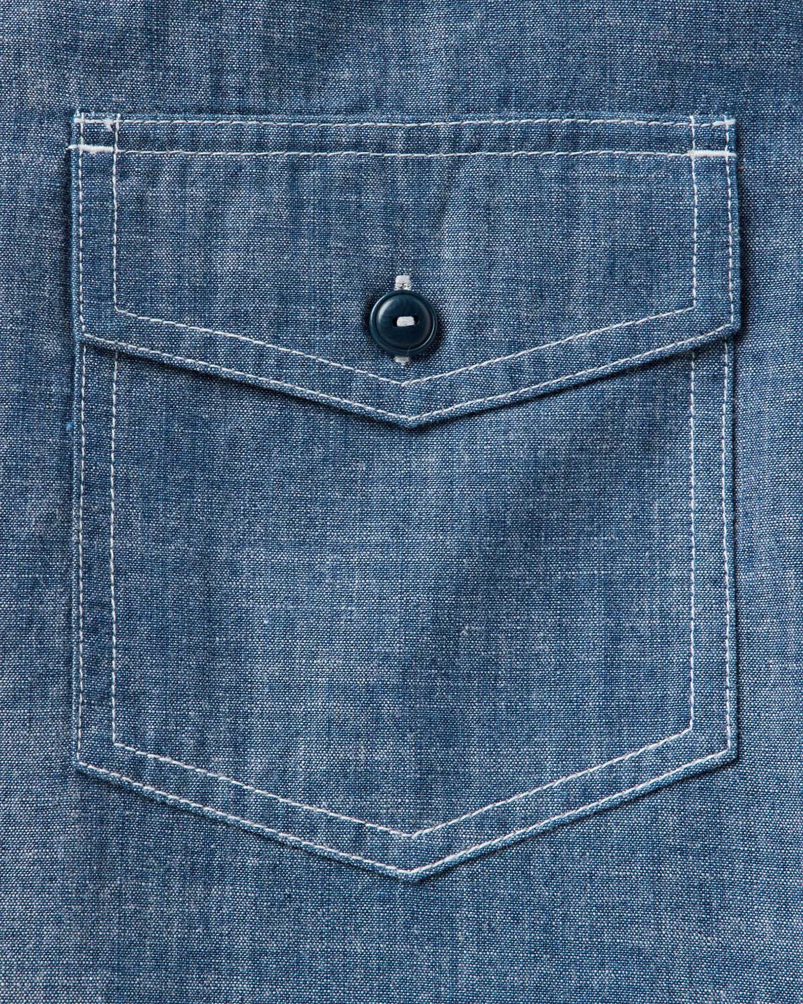 material shot of the pocket on The Short Sleeve Crew Shirt in Washed Indigo Chambray, Wovens by Taylor Stitch