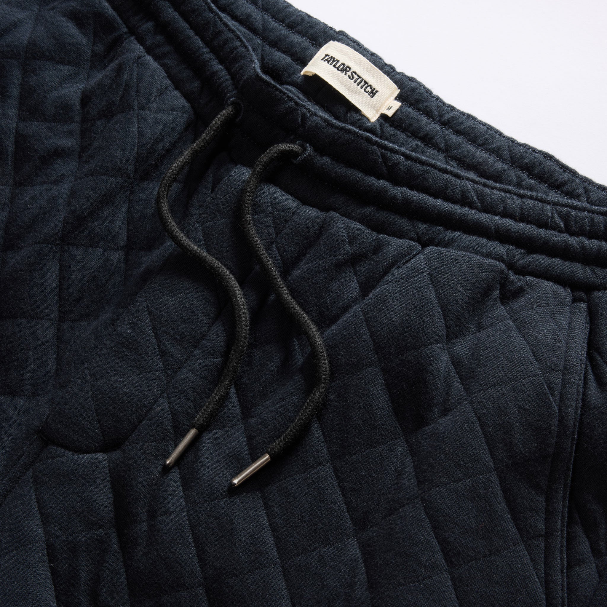 material shot of the drawcords on The Quilted Jersey Pant in Midnight Heather, Bottoms by Taylor Stitch