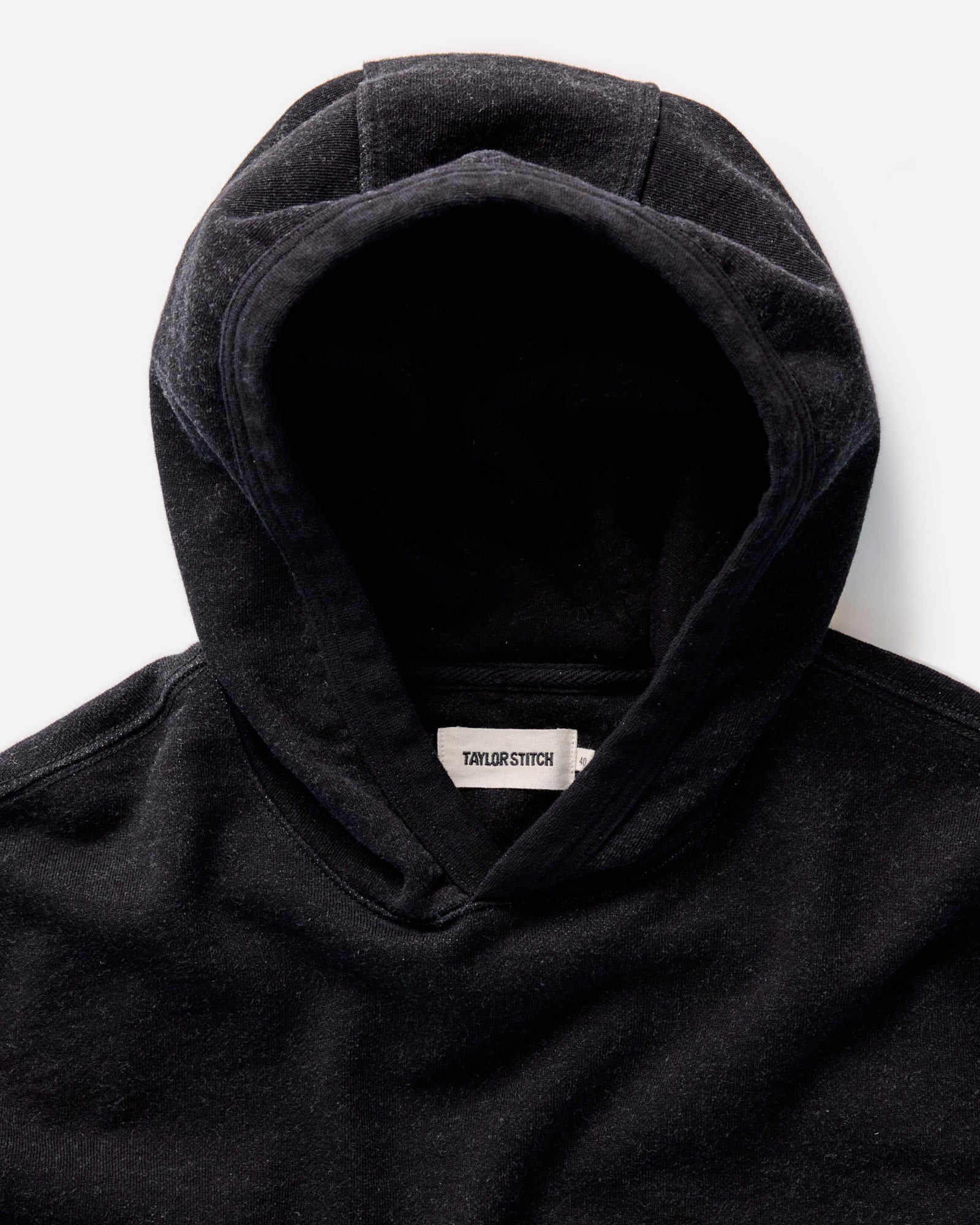 material shot of the hoodie on The Apres Hoodie in Black Indigo Terry, Knits by Taylor Stitch