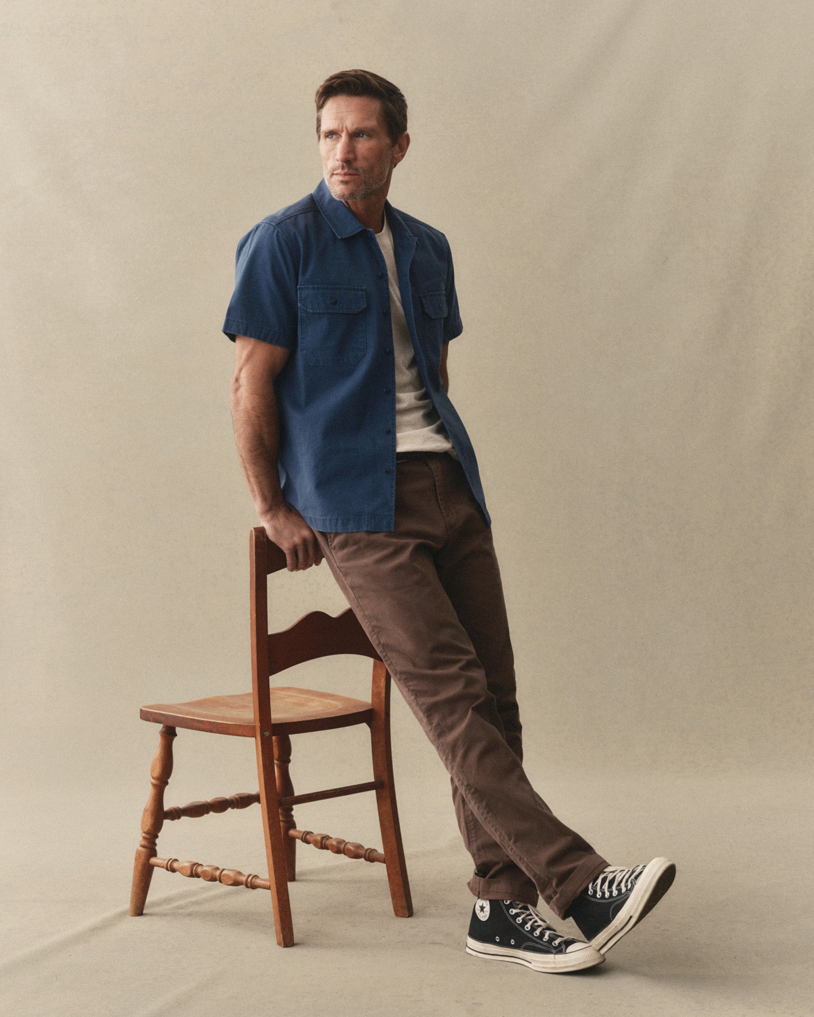 fit model posing in The Democratic Foundation Pant in Organic Espresso, Bottoms by Taylor Stitch