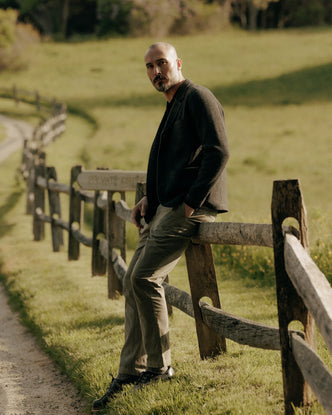 fit model posing in The Democratic Foundation Pant in Organic Smoked Olive