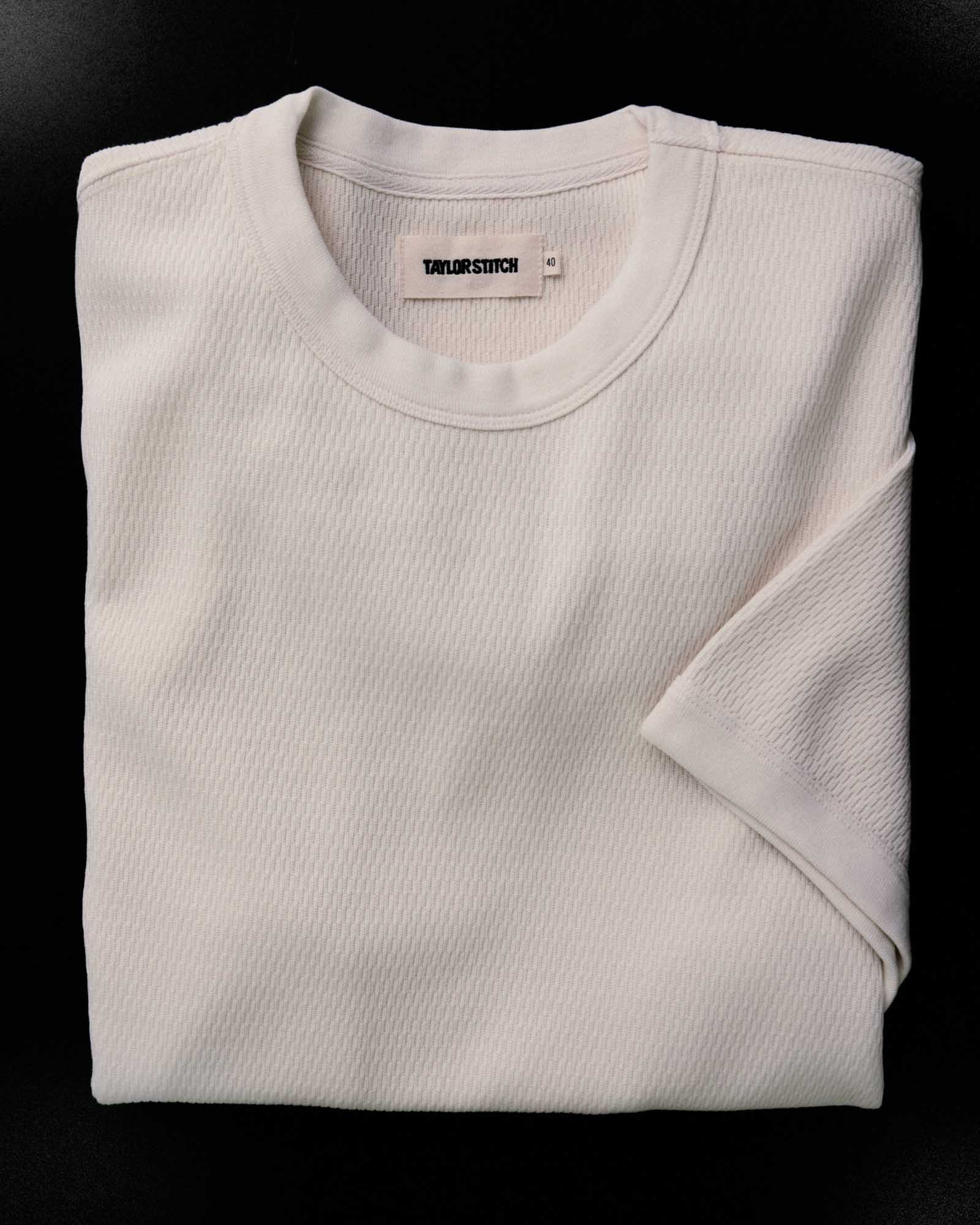 fit model with his hand in his pocket wearing The Organic Cotton Short Sleeve Crew in Vintage White Waffle, Knits by Taylor Stitch