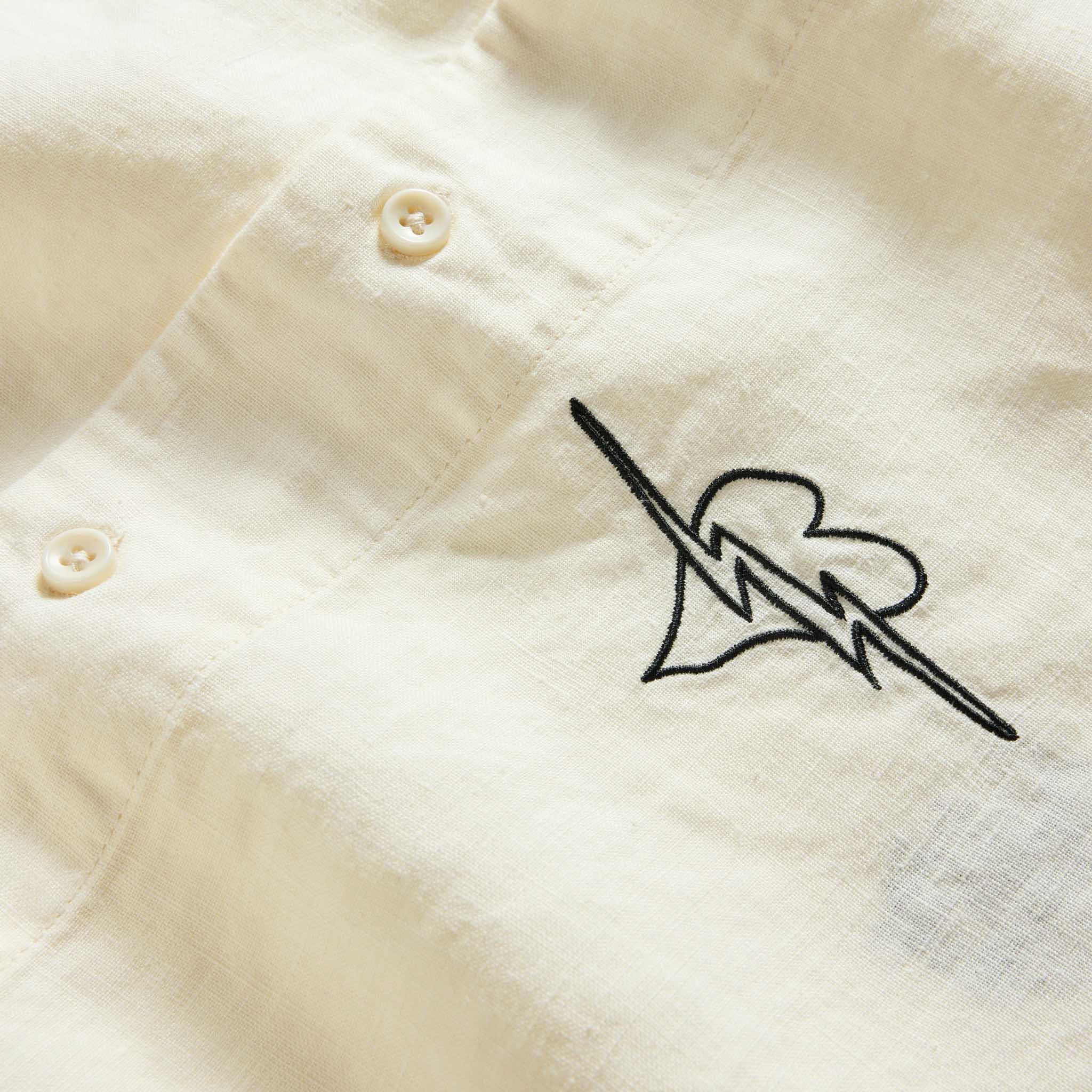 material shot of the buttons on The Short Sleeve Davis Shirt in Embroidered Natural, Wovens by Taylor Stitch