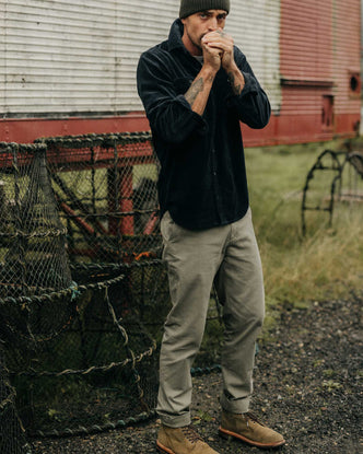 fit model posing in The Slim Foundation Pant in Organic Smoked Olive