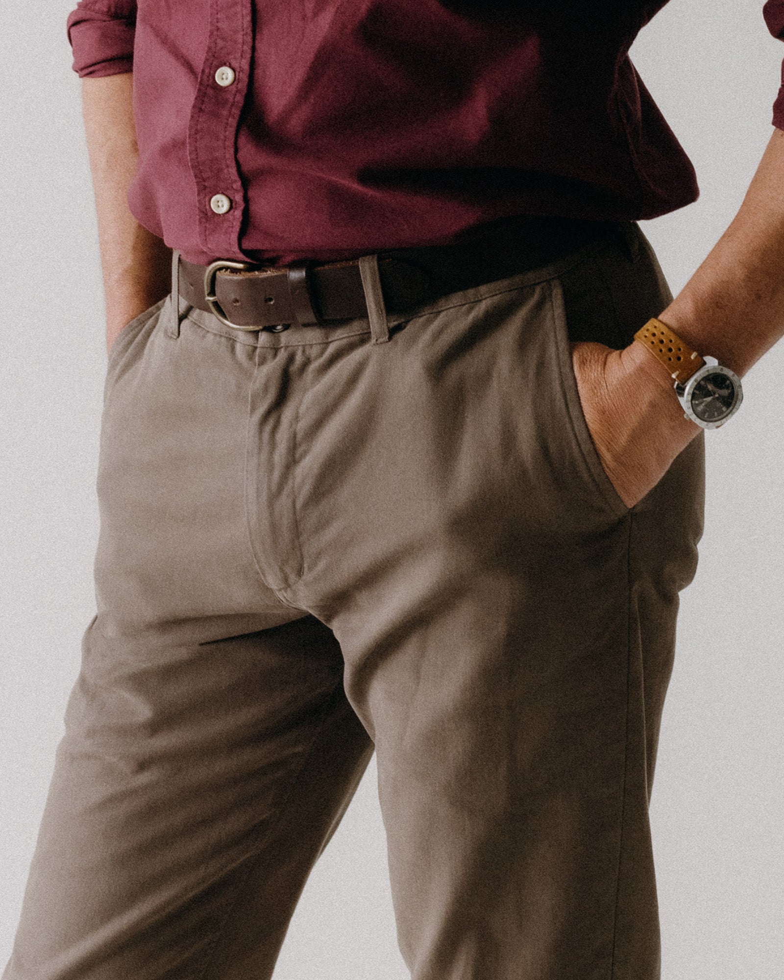 fit model with his hand in the pocket of The Slim Foundation Pant in Organic Espresso, Bottoms by Taylor Stitch