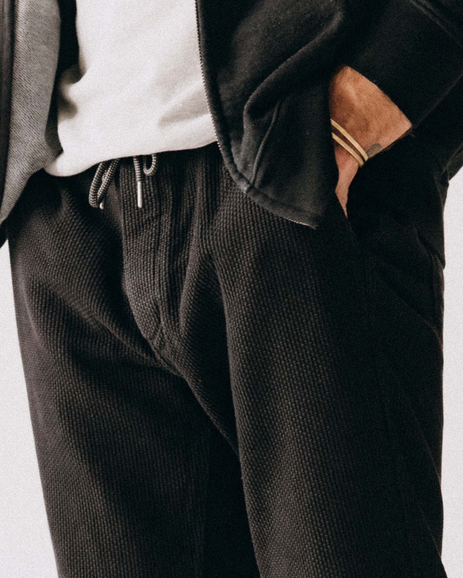 fit model posing in The Apres Pant in Black Indigo Sashiko, Bottoms by Taylor Stitch