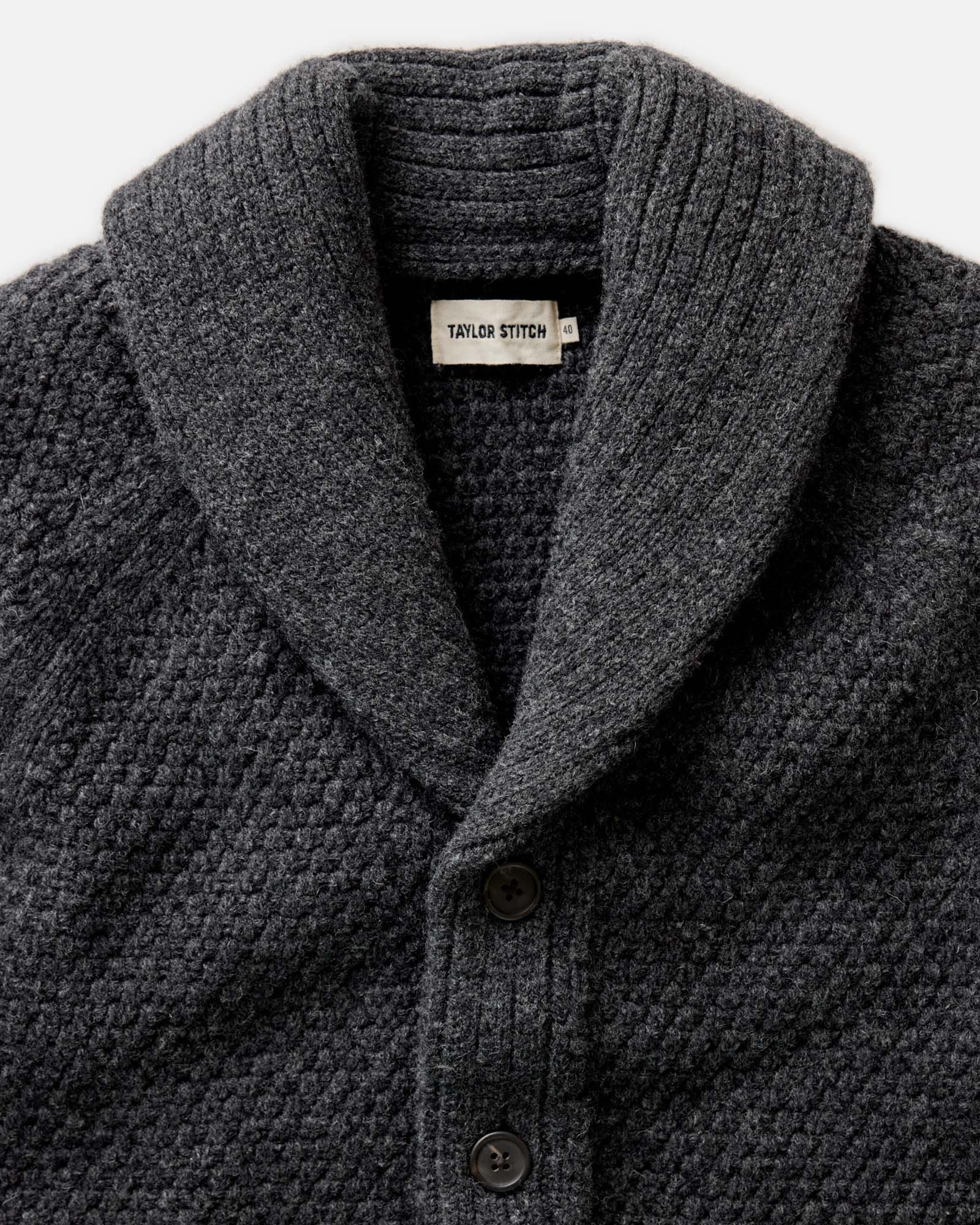 material shot of the collar on The Fisherman Shawl Cardigan in Heather Coal Merino, Knits by Taylor Stitch