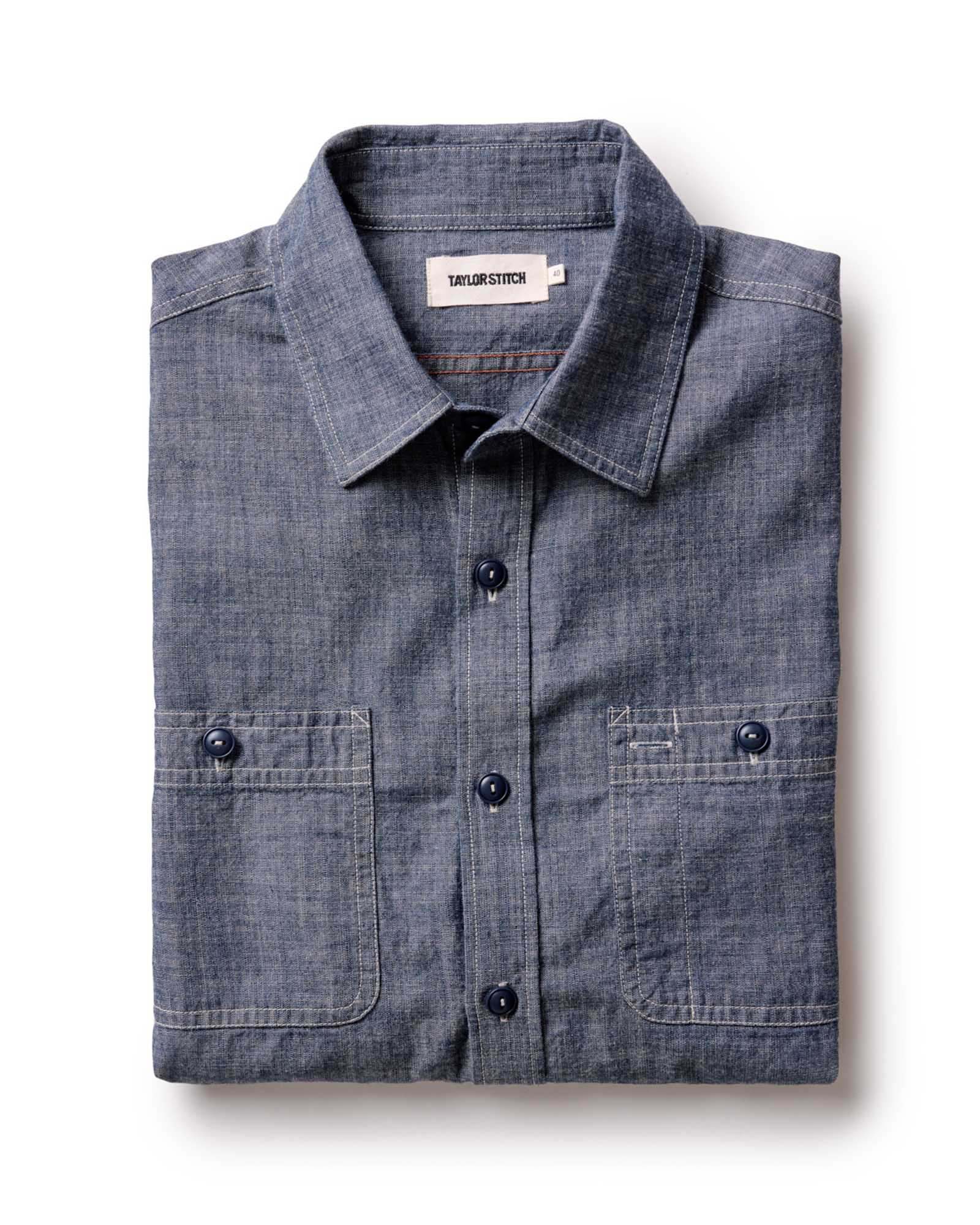 folded flatlay of The Foundry Shirt in Rinsed Indigo Chambray, Wovens by Taylor Stitch